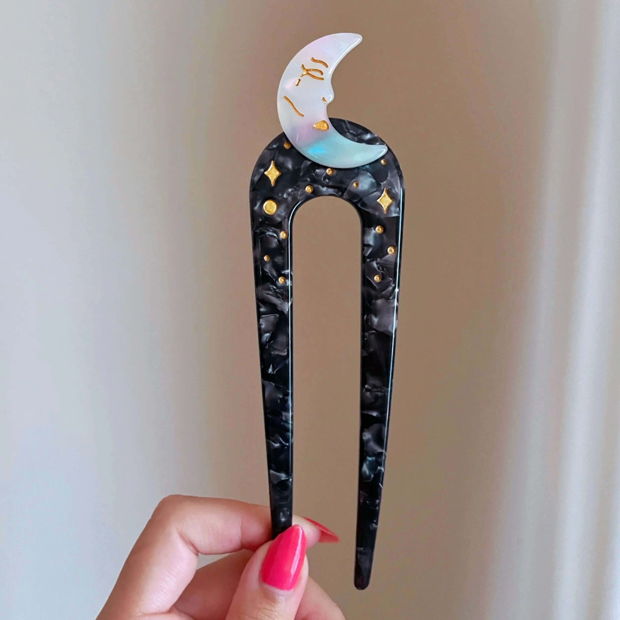 crescent moon french hair pin iridescent acetate celestial accessory by lilly baik.
