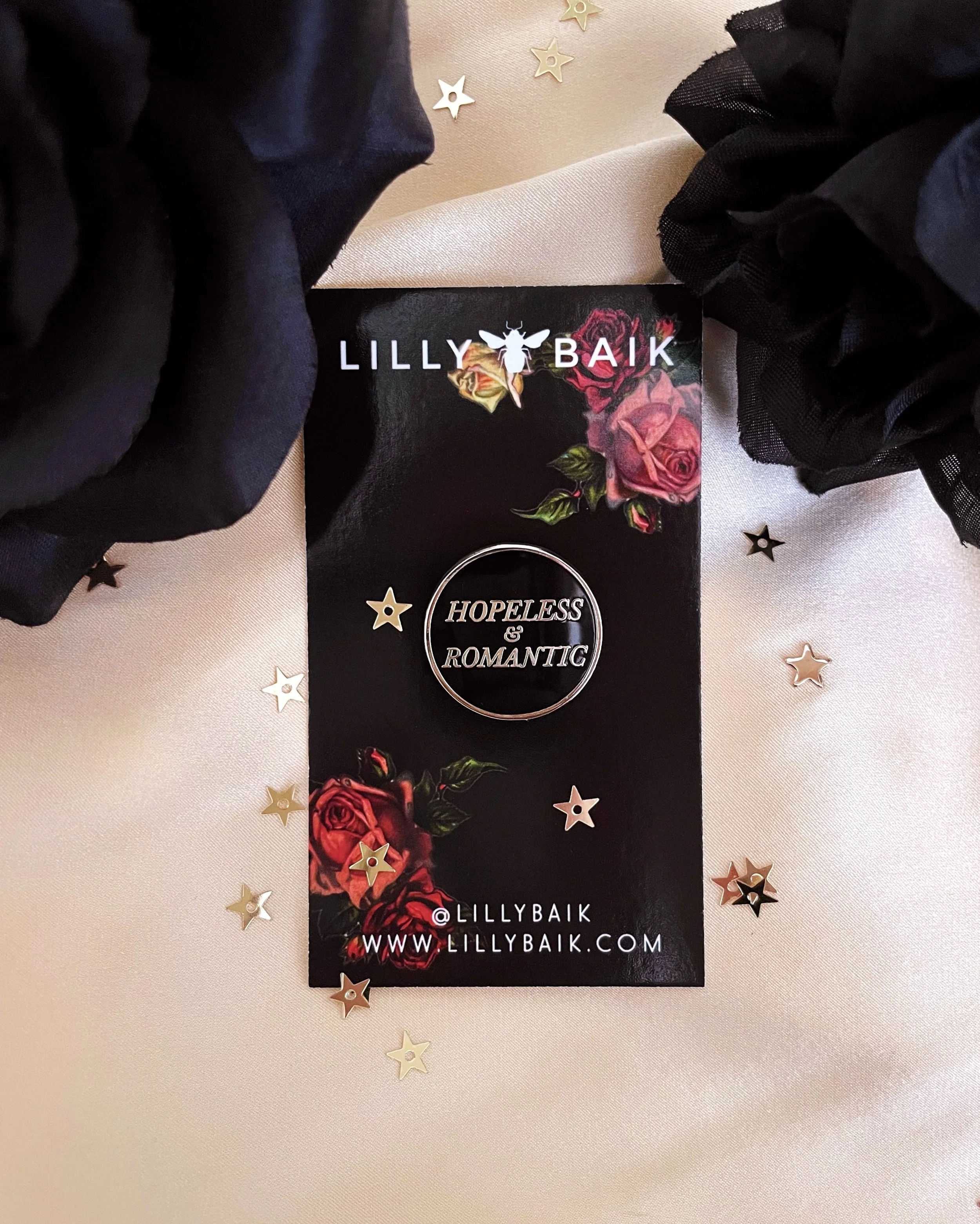 hopeless and romantic black and silver hard enamel pin by lilly baik.