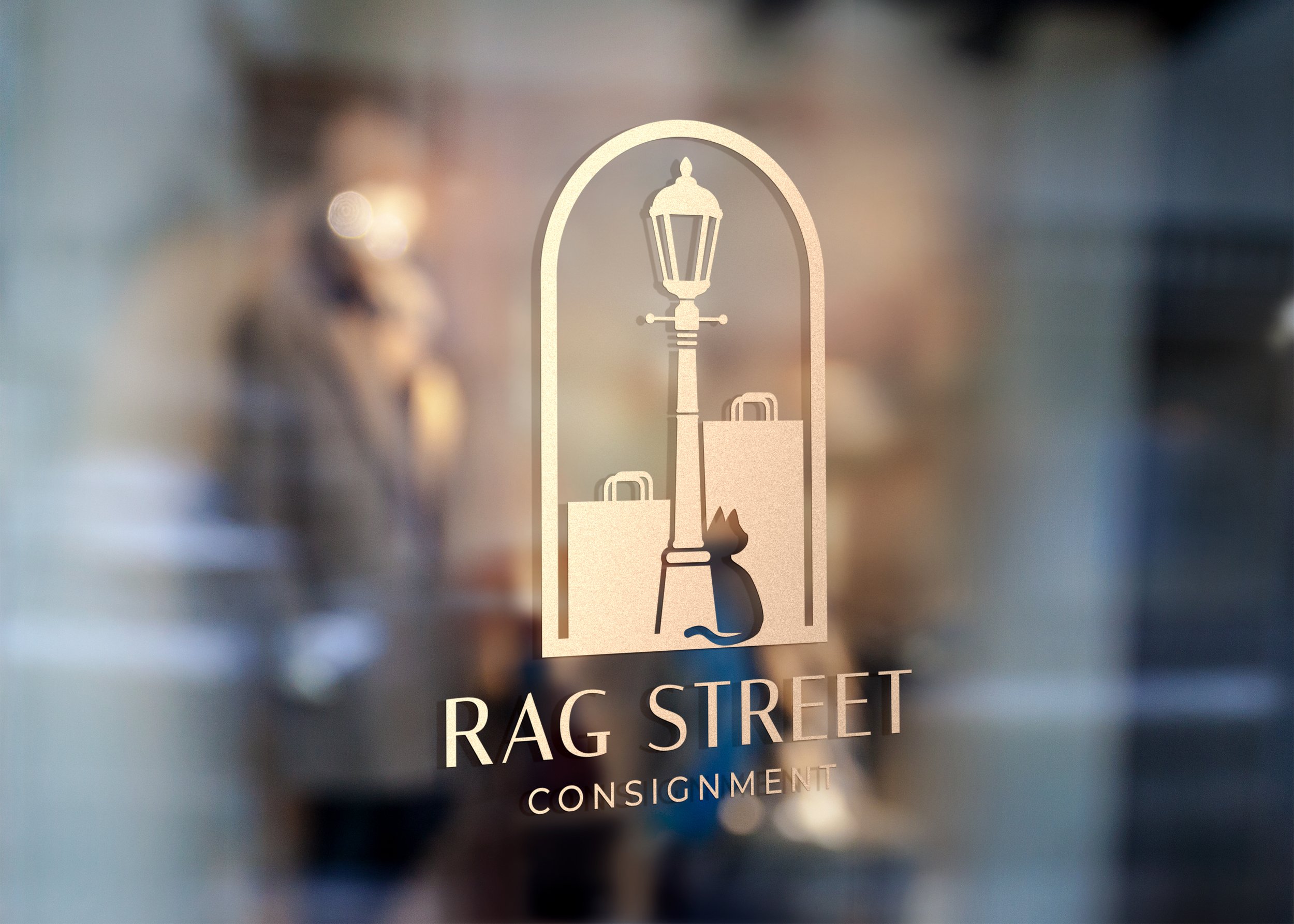 Storefront window mockup of logo design for Rag Street Consignment