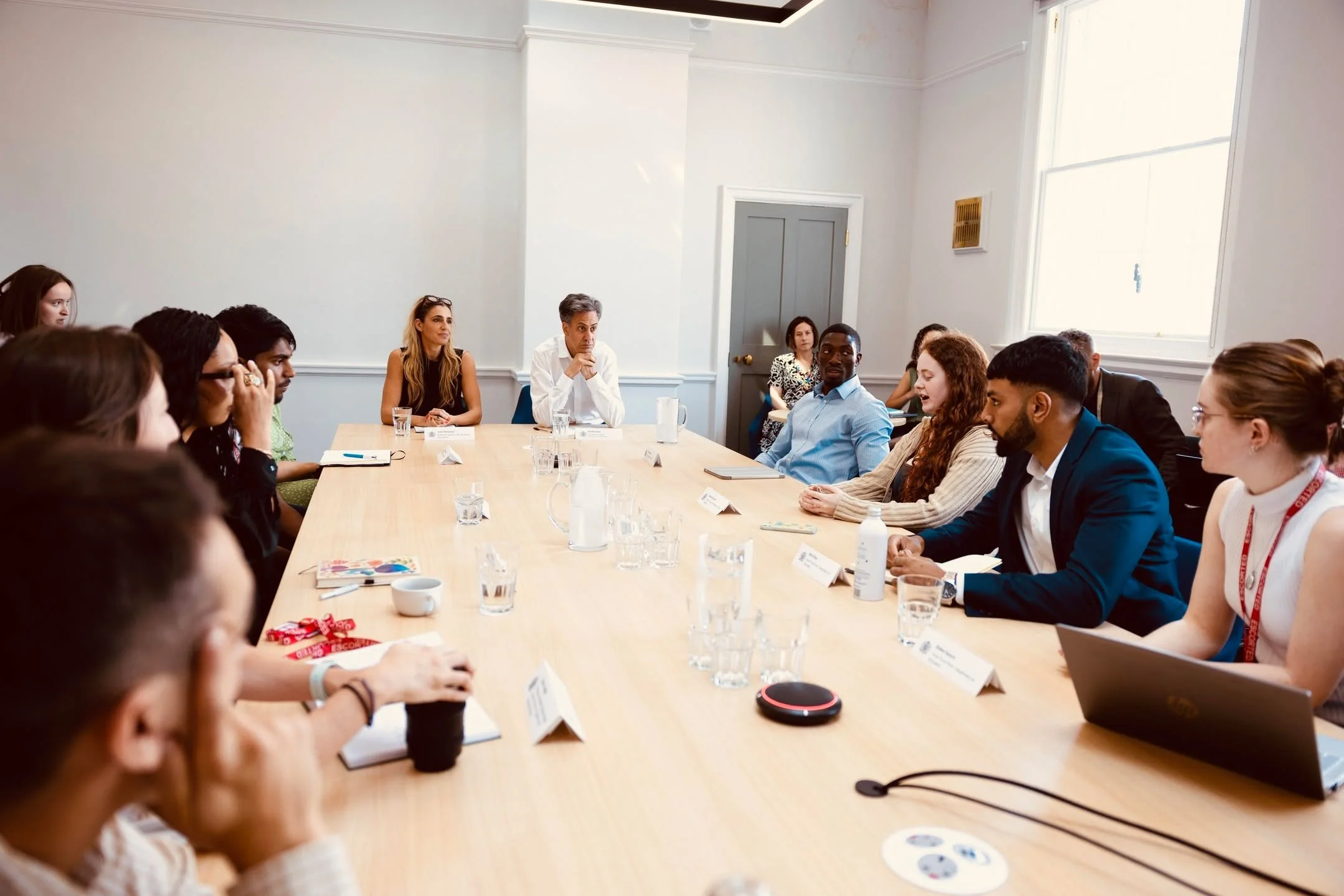 The UK Government's Department for Energy Security and Net Zero and We Are Family Foundation (WAFF) convened a roundtable of climate youth leaders, chaired by Secretary of State Ed Miliband and WAFF's Executive Director Jess Teutonico, to discuss how