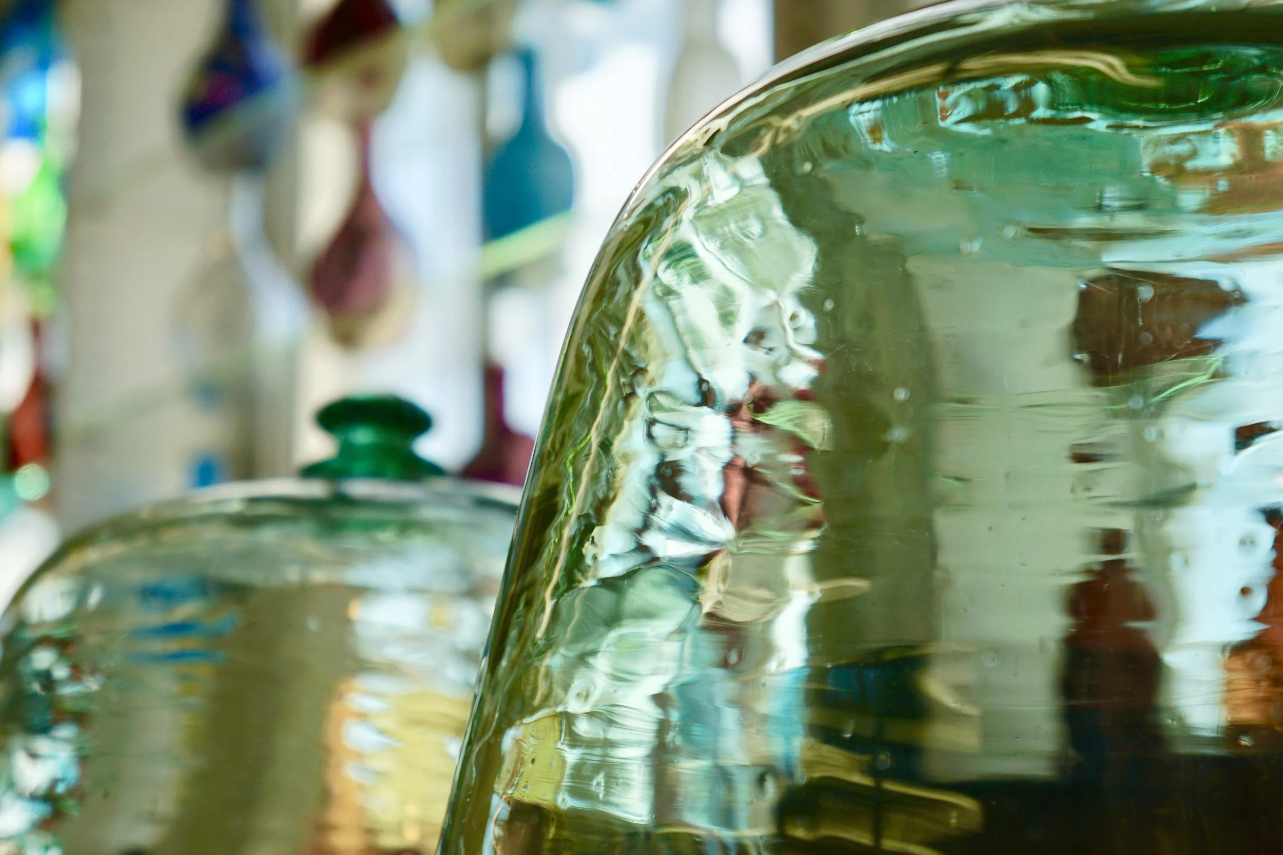 A photo of glass artifacts inside the Heritage Glass Museum.