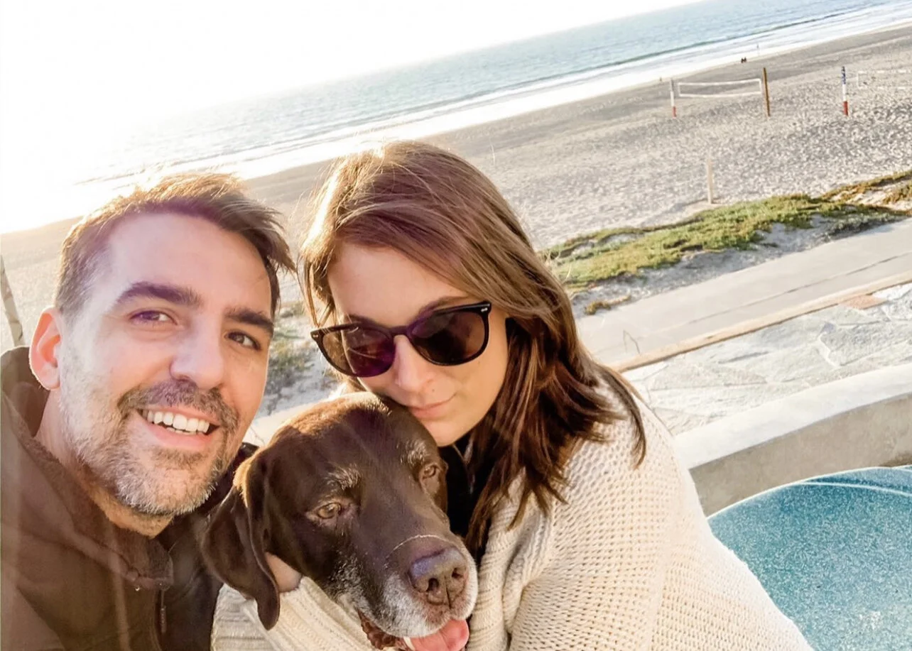 Julia with her husband, Dr. Antonio Pedraza Reales, and their dog, Blue. Photo copyright: Julia Adele Design.
