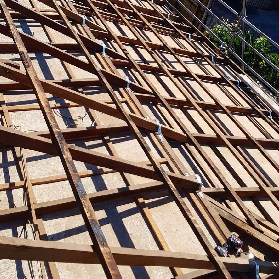 What goes on beneath the sheeting? Australian Building Codes! It&rsquo;s important that each component of your house is matched to the wind ratings for the site. Roof rafters, for example, are anchored to the rest of the structure with steel tie-down