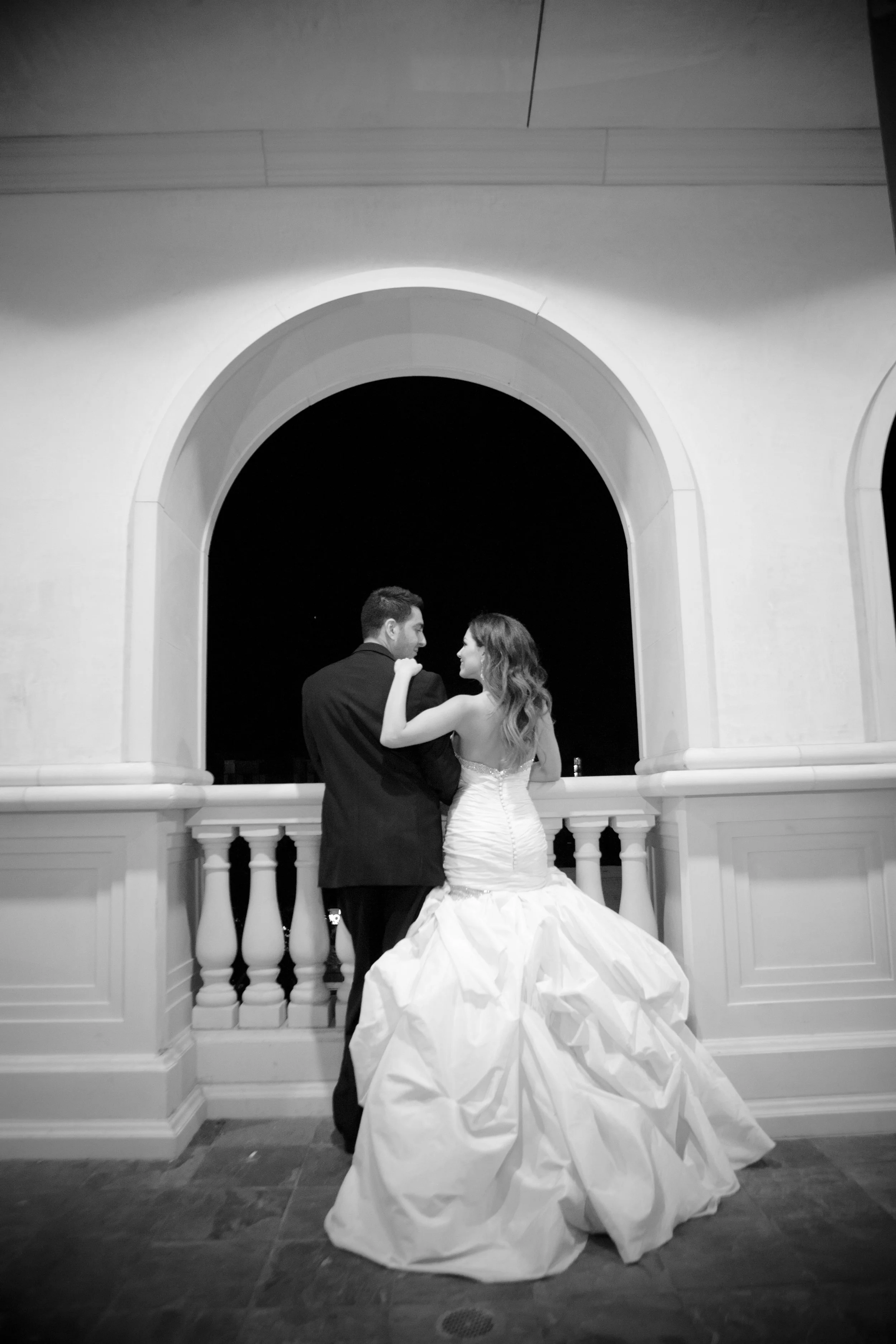 Bride in mermaid wedding dress with groom on wedding day