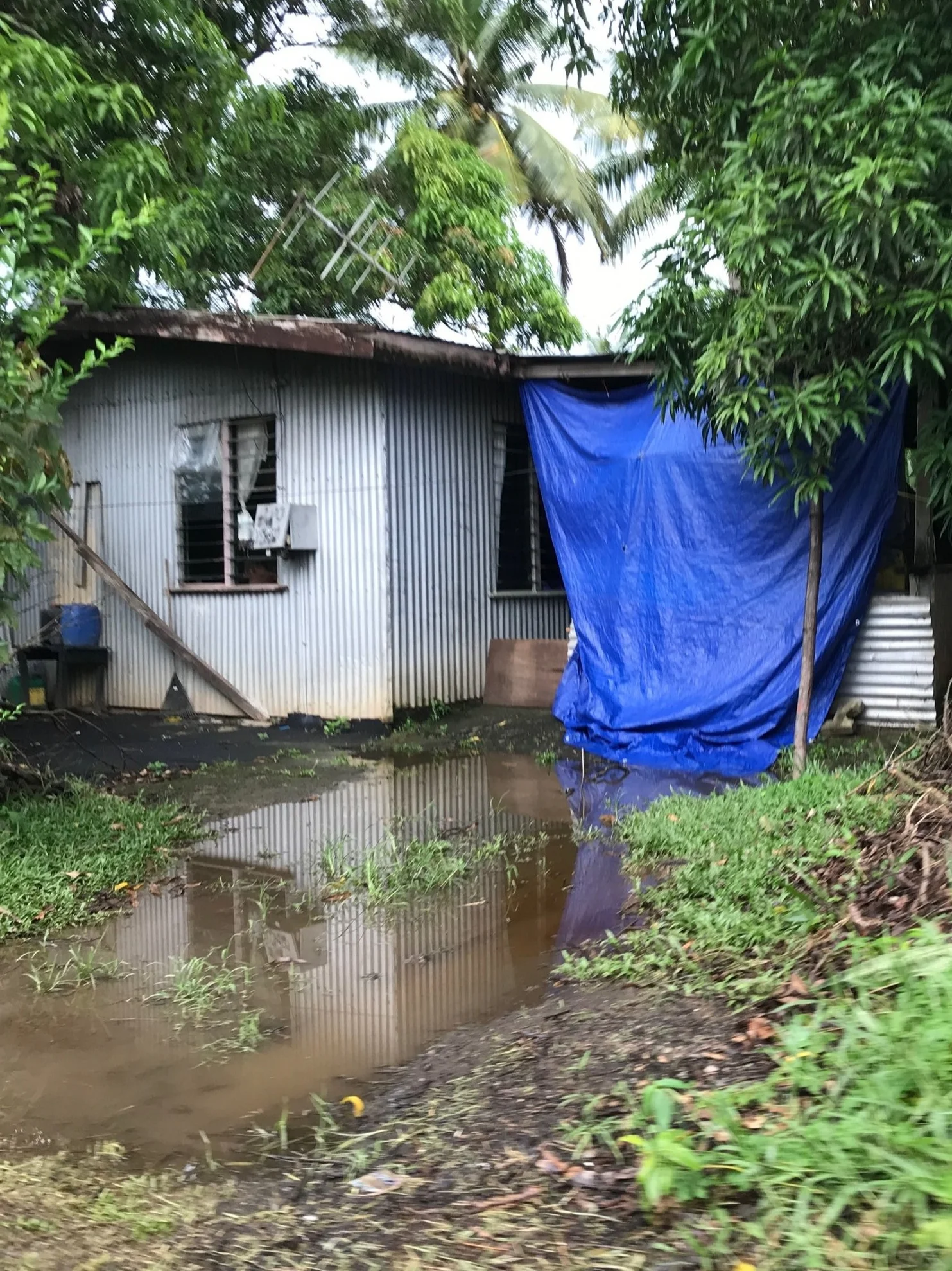 One of the informal settlement homes. This photo was taken approximately five minutes after moderate rainfall. As the settlement is located in a flood-prone region, heavy rains often result in home being entirely submerged beneath water levels. PhoTo by Yanik Rozon.