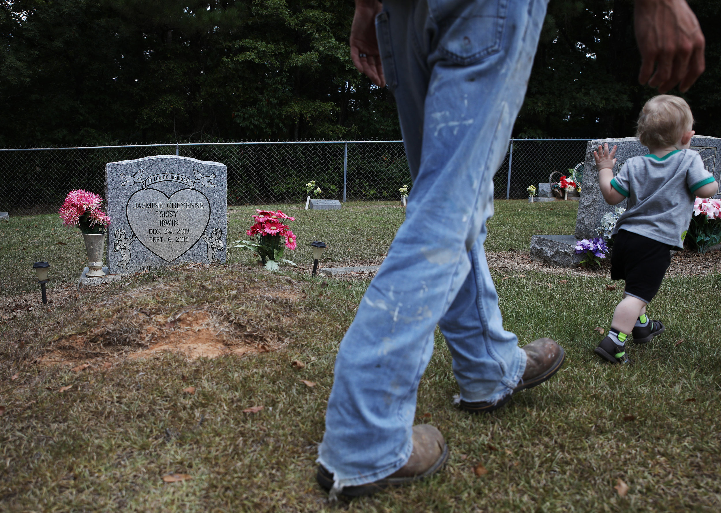 Dylan Mann chases after his 14-month-old stepson Jason while they visit the grave of Dylan's niece, Jasmine. Jasmine was 2-years-old when she was killed by her mother, Tami Mann. Jasmine was killed in September of 2015 and this is the first time that Dylan has visited her grave.