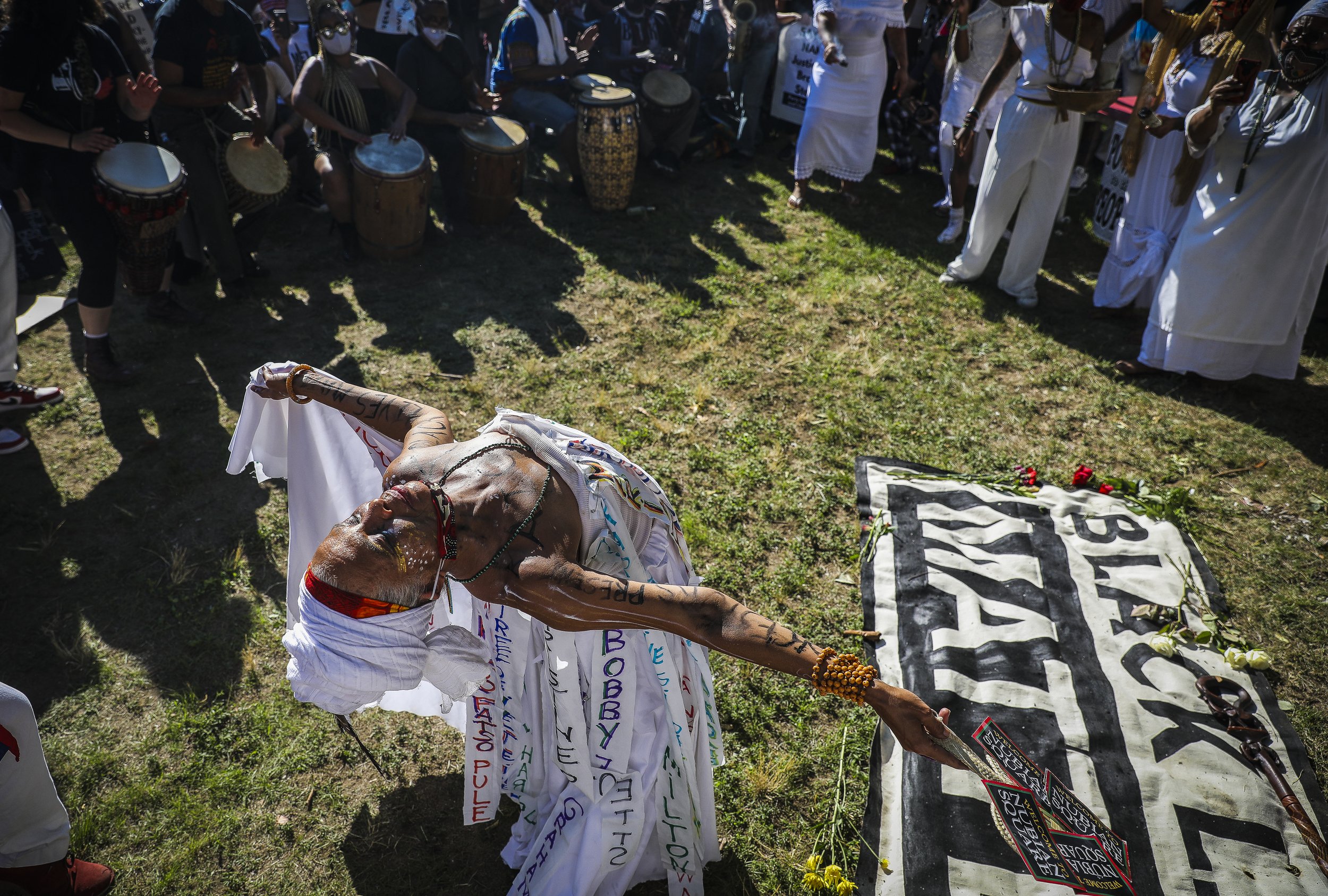  Isaura Oliveira dances while holding a sacred space for the Black women who have been slain by law enforcement. More than 1,000 people gathered Saturday afternoon to celebrate the lives of Black women and demand an end to police violence, with a mar