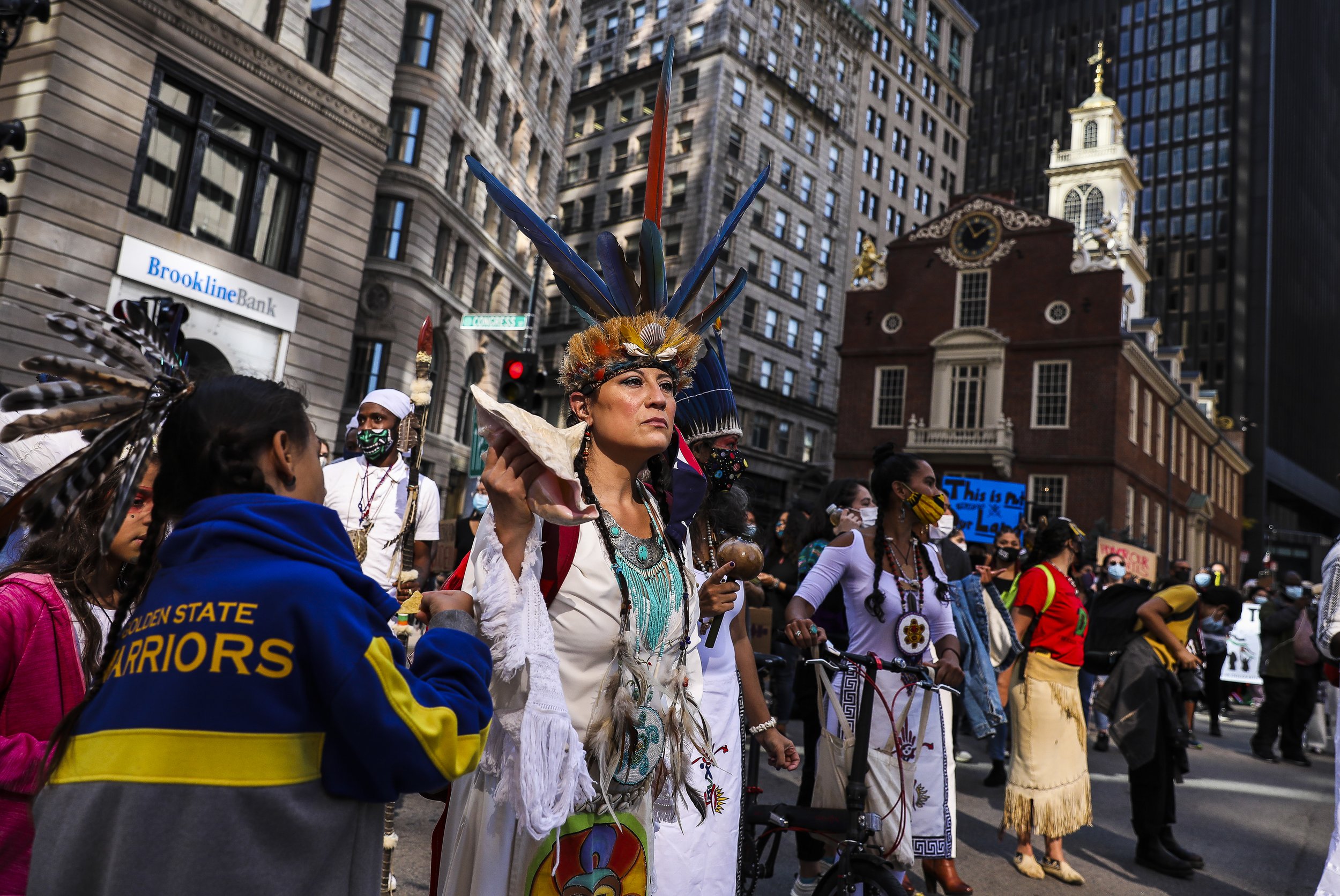  Chali'Naru Dones, with the United Confederation of Taino People, marches past the Old State House while participating in the Indigenous Peoples Day rally and march on Saturday afternoon. The United American Indians of New England organized a demonst