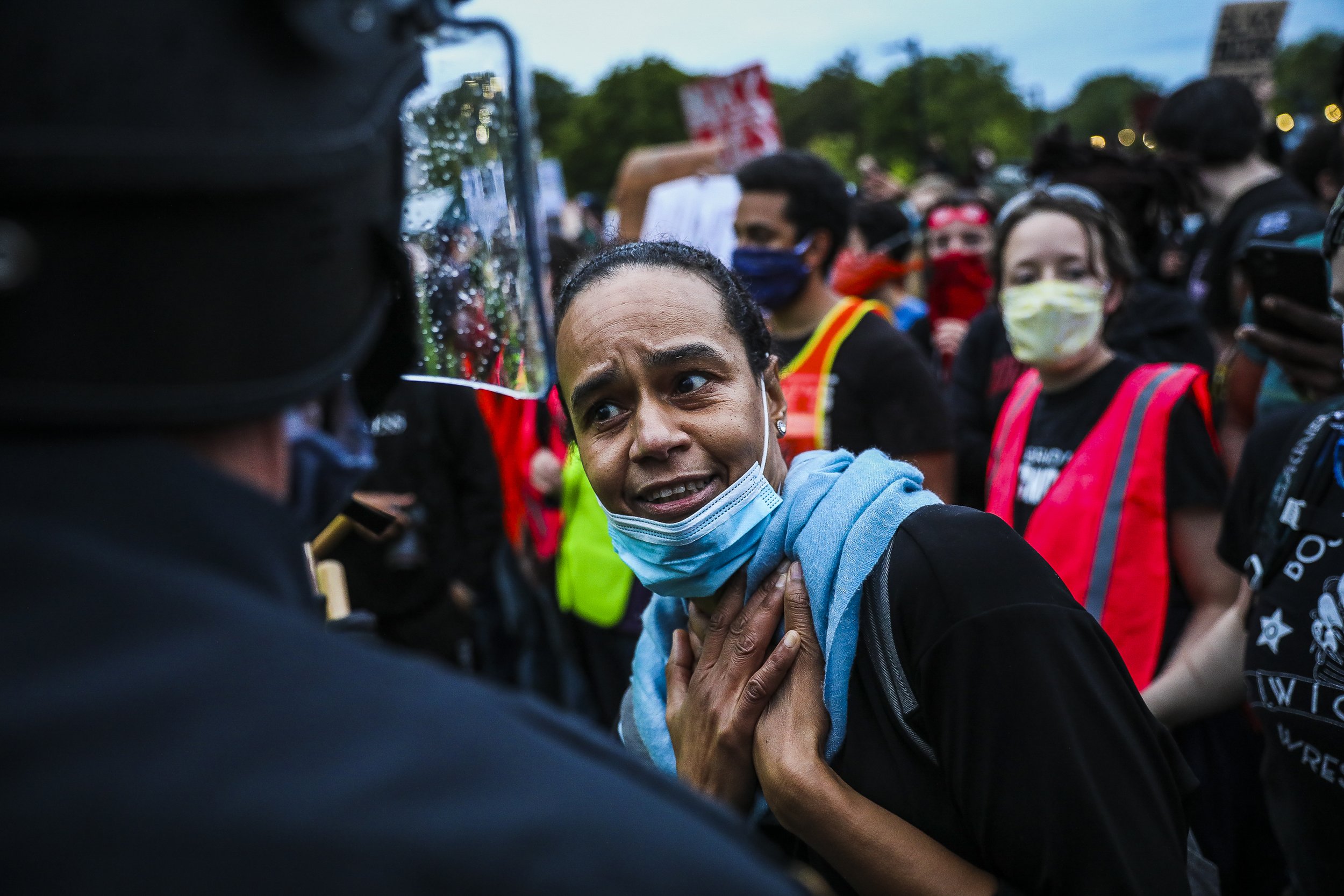  A woman tries to reason with the Boston Police to as she participates in a demonstration outside of the Forest Hills T Station. The rally and vigil took place on Blue Ave by Franklin Park to honor George Floyd, Breonna Taylor, Ahmaud Arbery and loca