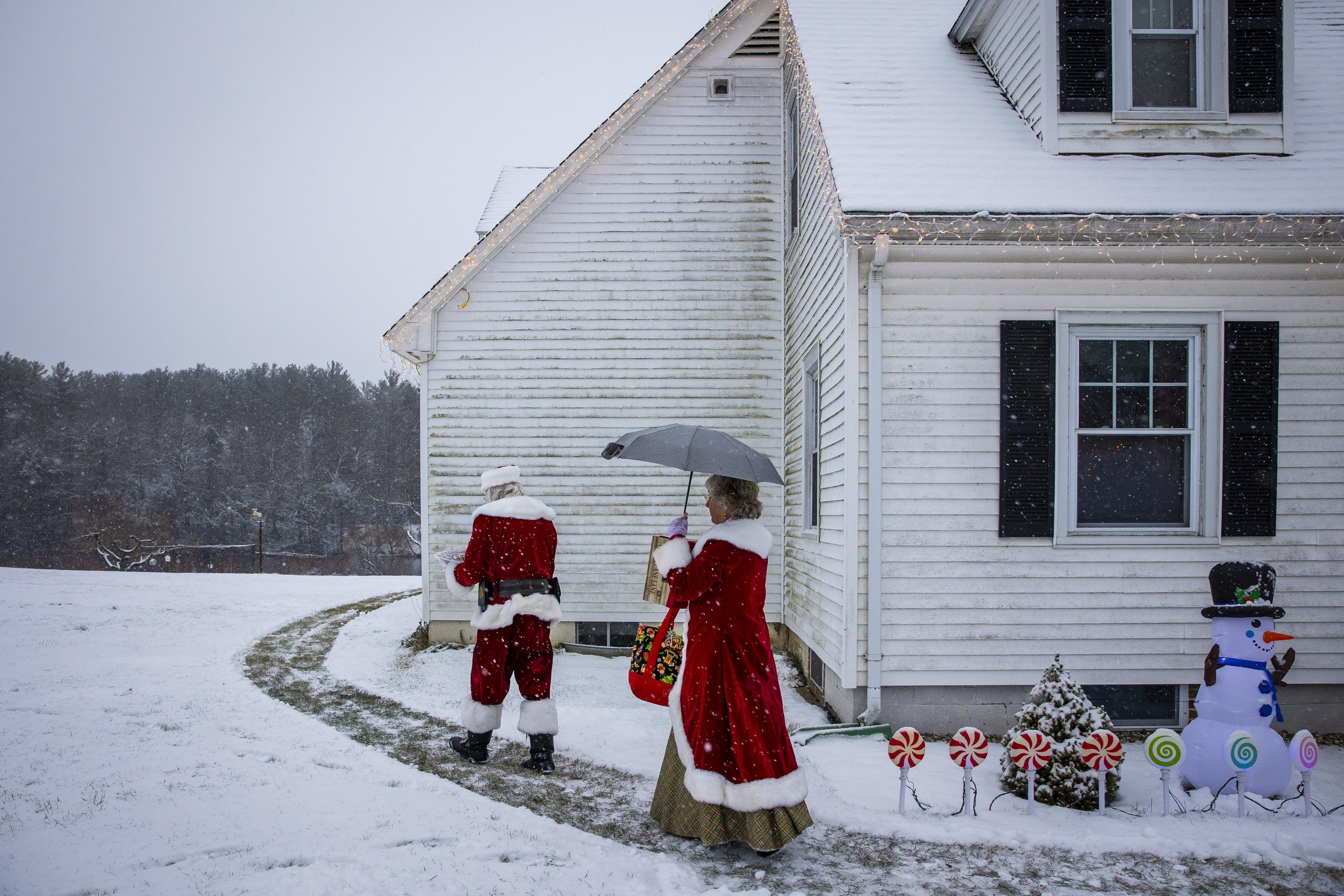  Lenny and Becki Stratton arrive to a home visit in Shelburne, Mass. on December 11, 2022. A cookie swap with an extended family, it’s the first home visit that the Stratton’s ever had — almost ten years ago.  