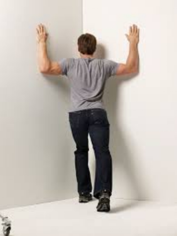 You might have to find a strategic location in your office to perform this stretch. You can always tell your boss you do your best thinking when you are in a corner! 