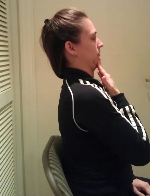Try to keep your chin level, don't let your neck extend. Imagine your chin is resting on a desk and you are trying to push it straight back. 