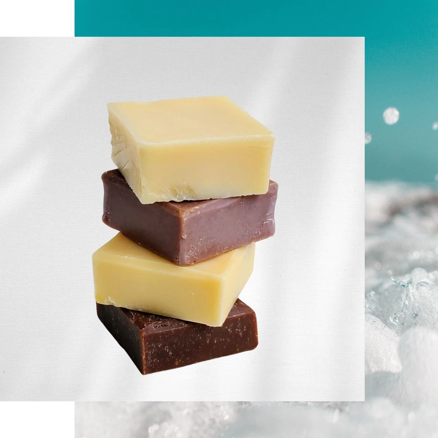 Stack of raw soaps on a turquoise background