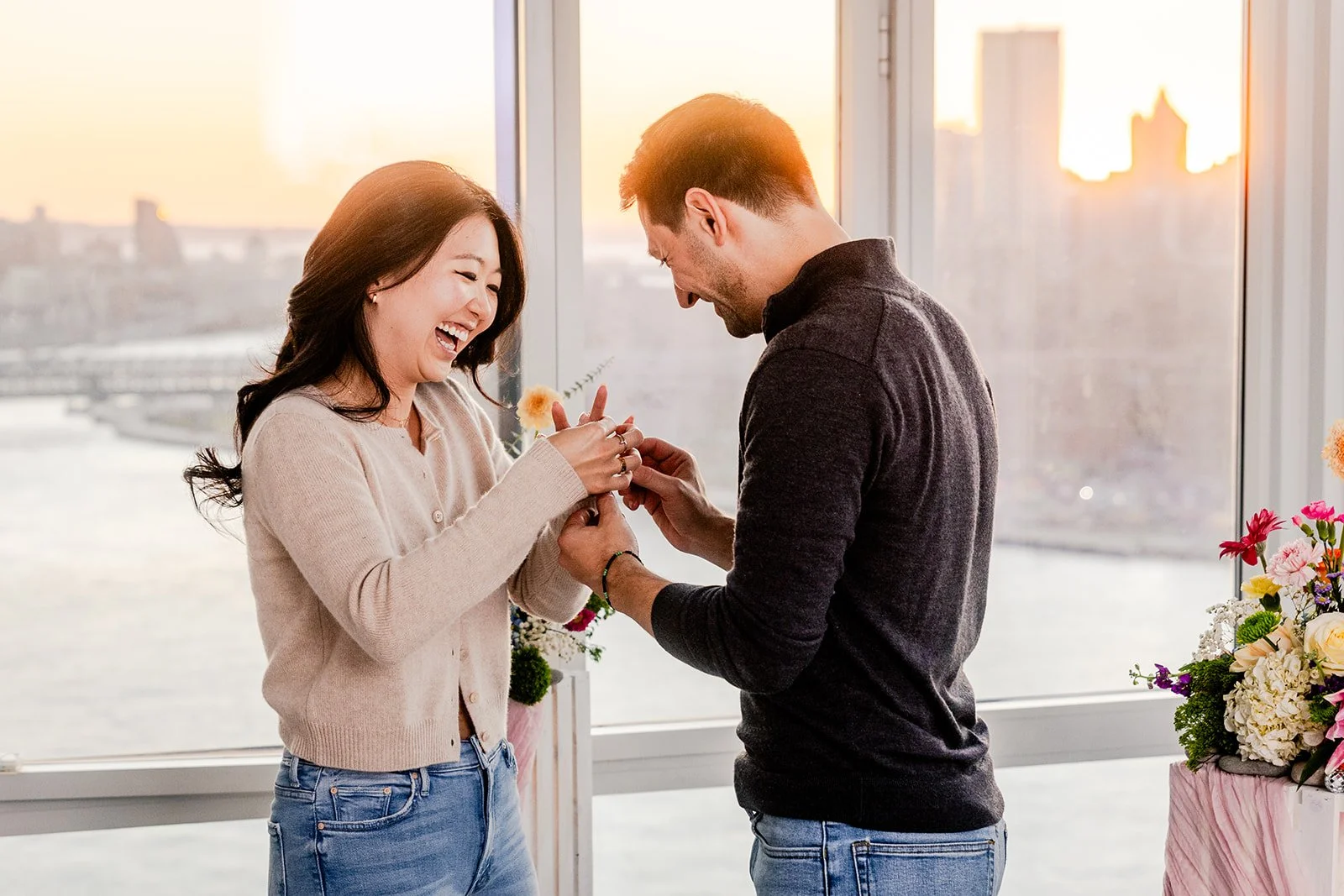 A man proposing to his girlfriend in their house.