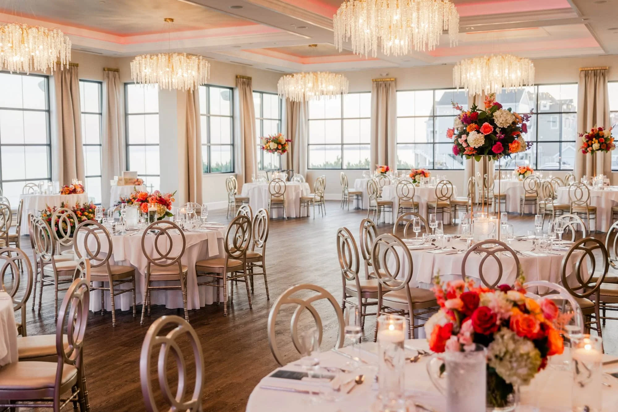 The reception hall at Tyde at Walnut Beach, fully decorated on a wedding day.