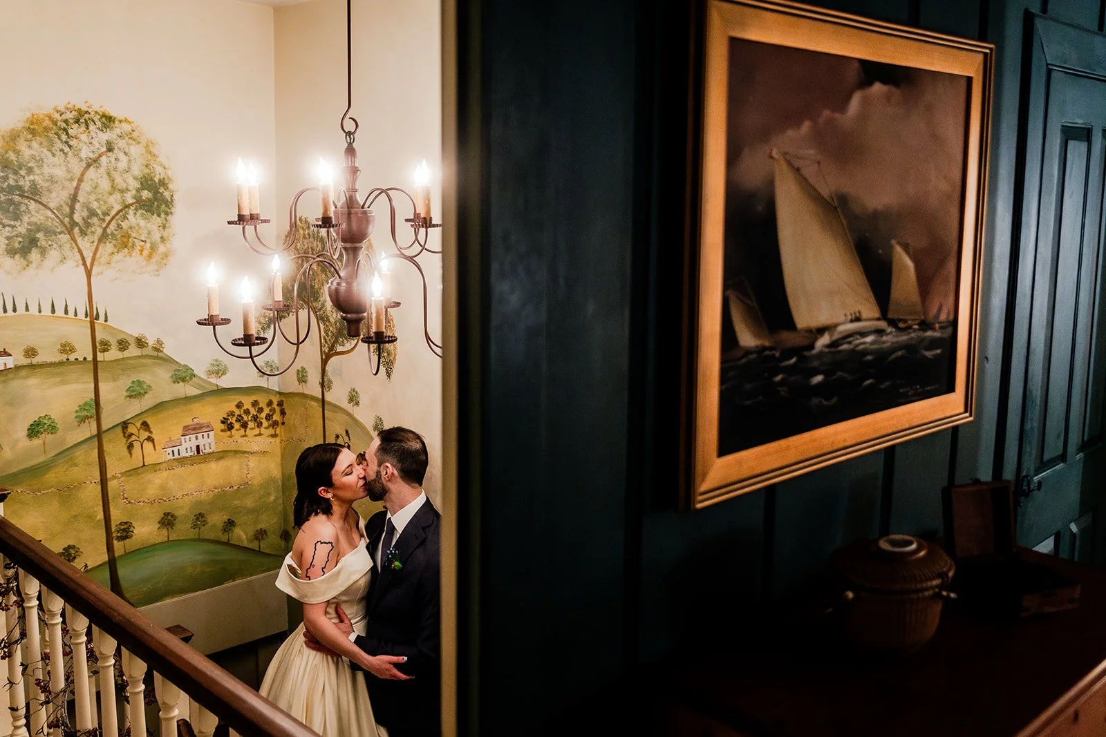 Bride and groom kissing in one of the stairways at Smith Farm Gardens wedding venue.