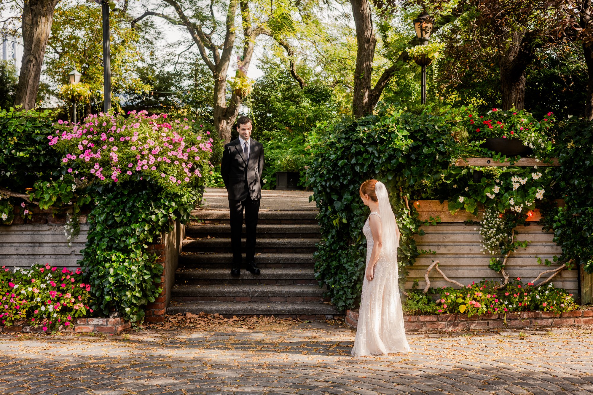 Bride seeing her future husband for the first time on their wedding day.