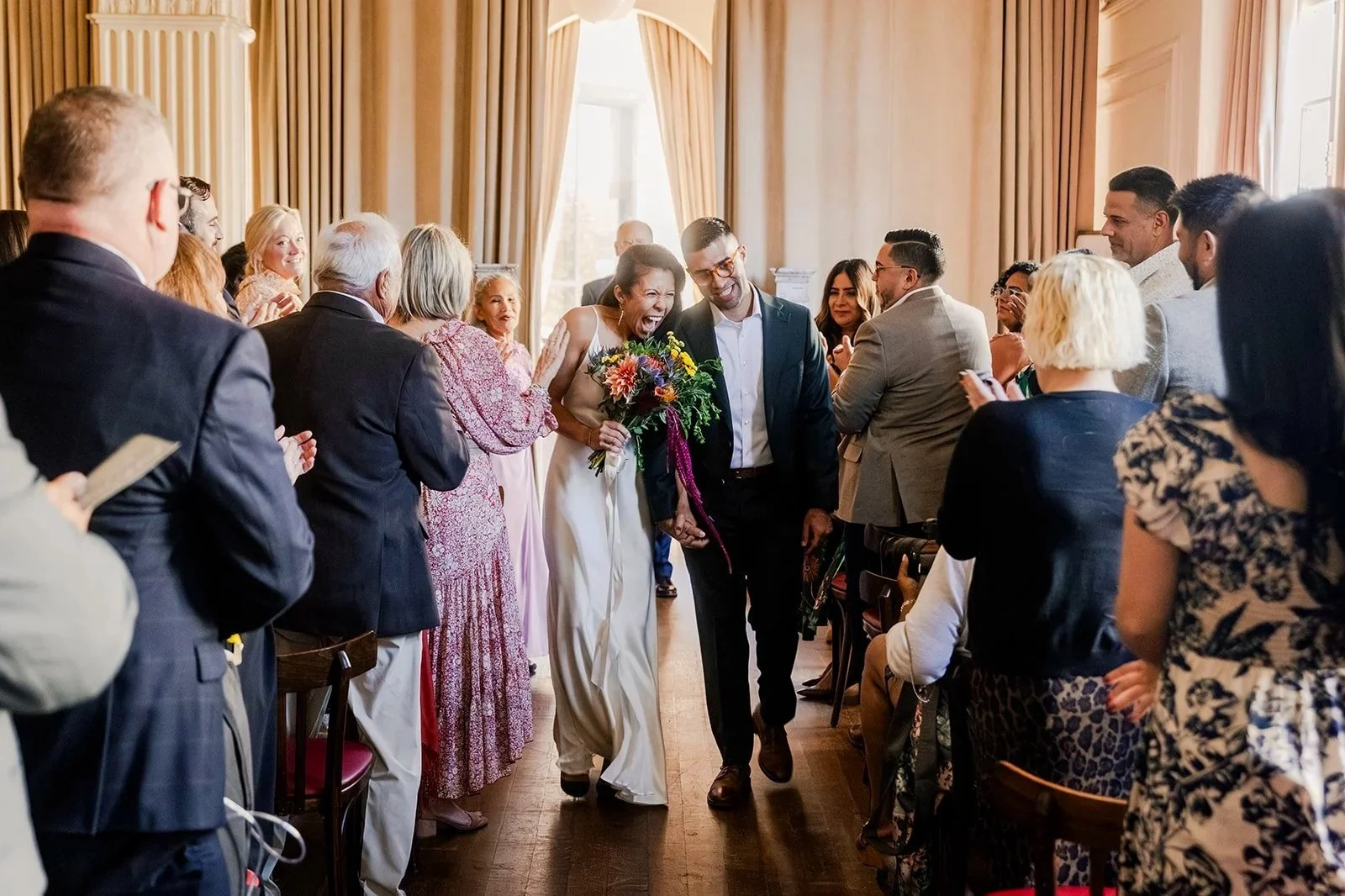 Bride and groom recessing after their wedding ceremony.