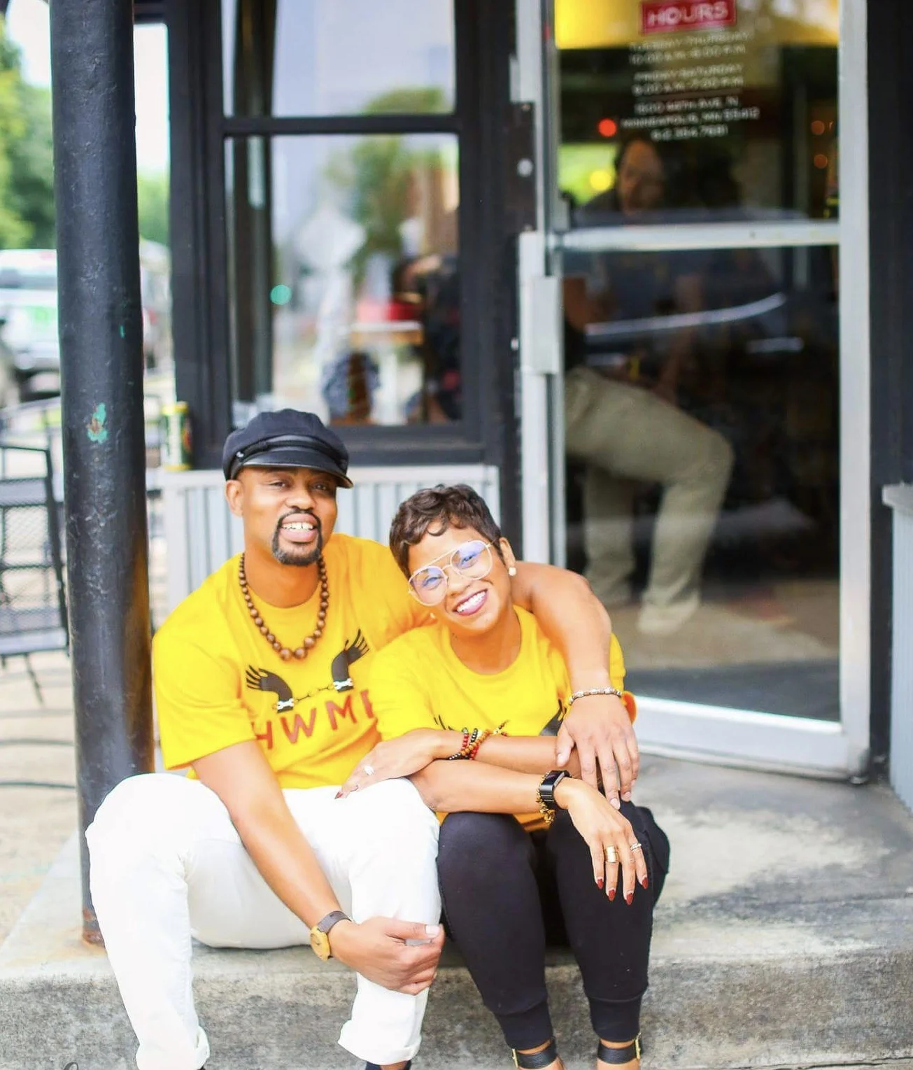 White and his wife Donise sit outside HWMR in warmer months. Donise inspired the women's clothing line at the shop. Photo by Katherine Harris