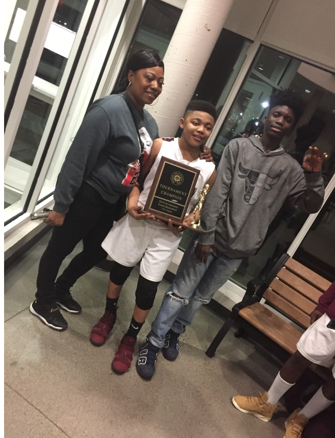 This me and my brother, Andre Frazier, and mom, Ashley Burns, at my little brother’s game after he won a championship on May 1. I love my family, and we were so happy after my brother’s win. He looks up to me, so him seeing me playing sports and stuff is what make him do the same. He sees me not being in the streets or hanging with the wrong crowd, and he does the same thing. My mom motivates both of us to the fullest in every sport that we play. She is at every one of our games; she makes sure that we eat healthy food, and she makes sure we stay in shape. She also comes to our practices. She makes sure our grades are ok. She tells us that if our grades aren't where she wants them to be that we don't be playing. She'll take basketball away from us if our grades aren't good or if we're doing something else we're not supposed to.