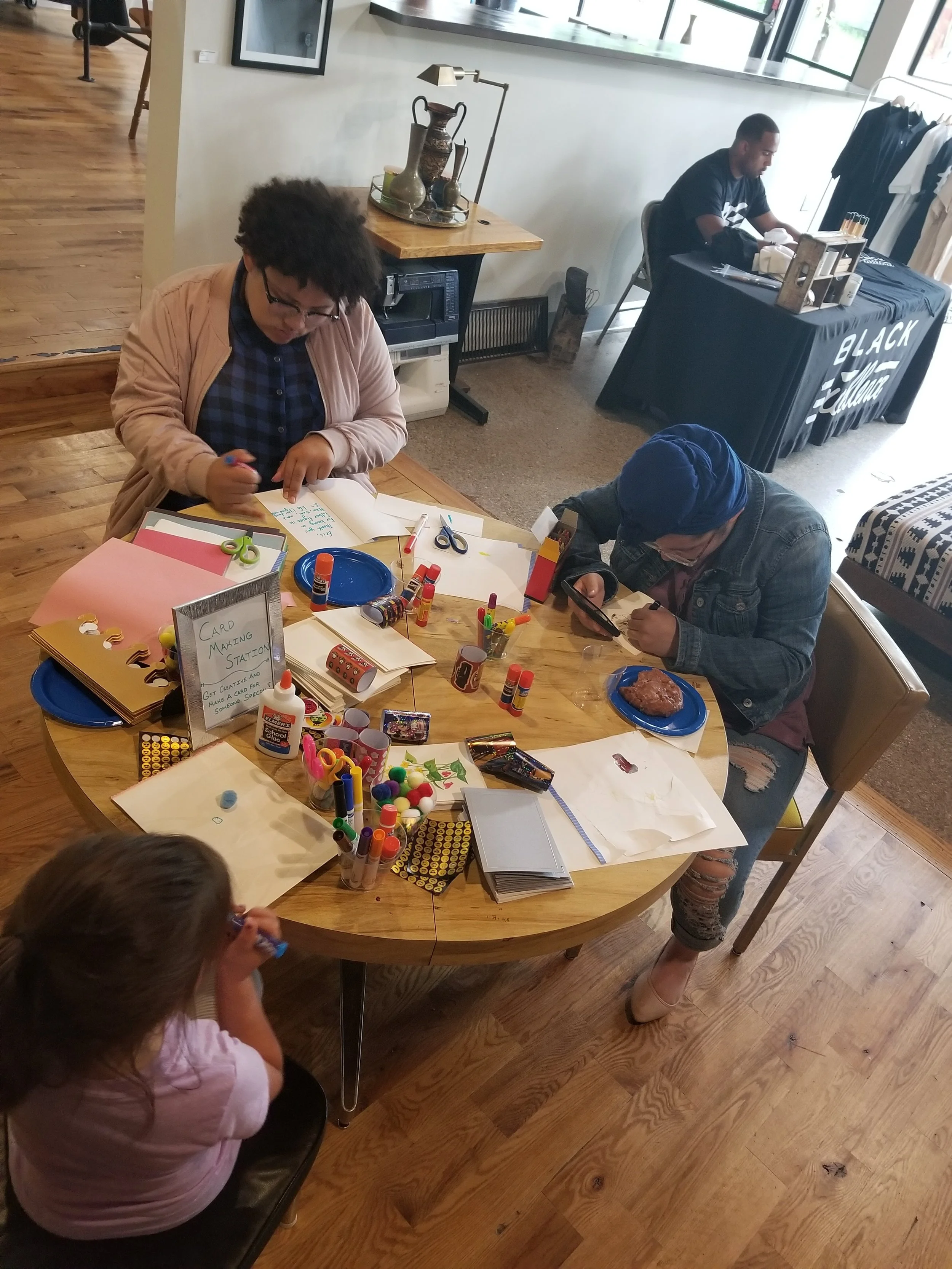 Angelina and Aliya Tchougo participated in the crafts offered at 'Dads, Dreams, and Donuts.' Photo by Markella Smith