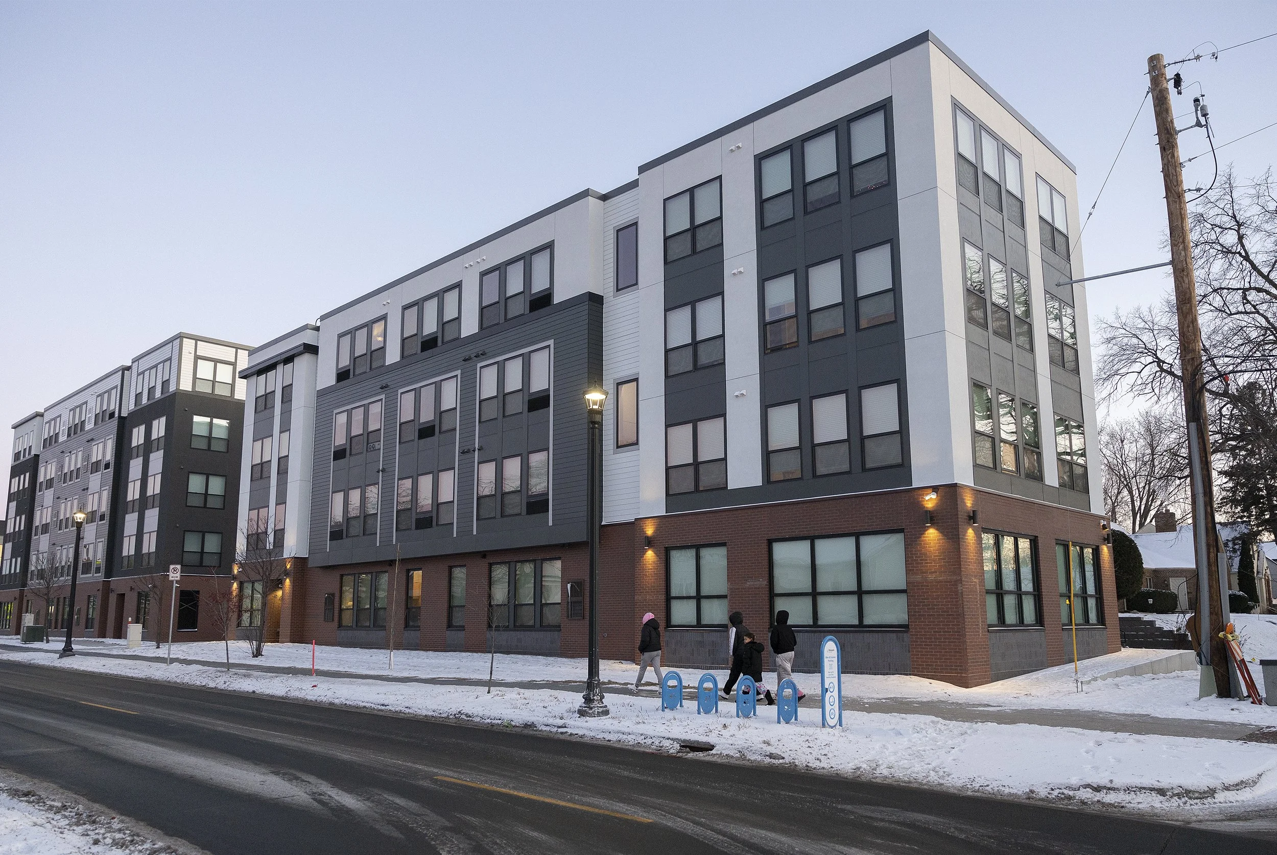 New apartment complex towers over a neighborhood. The residents want it torn down