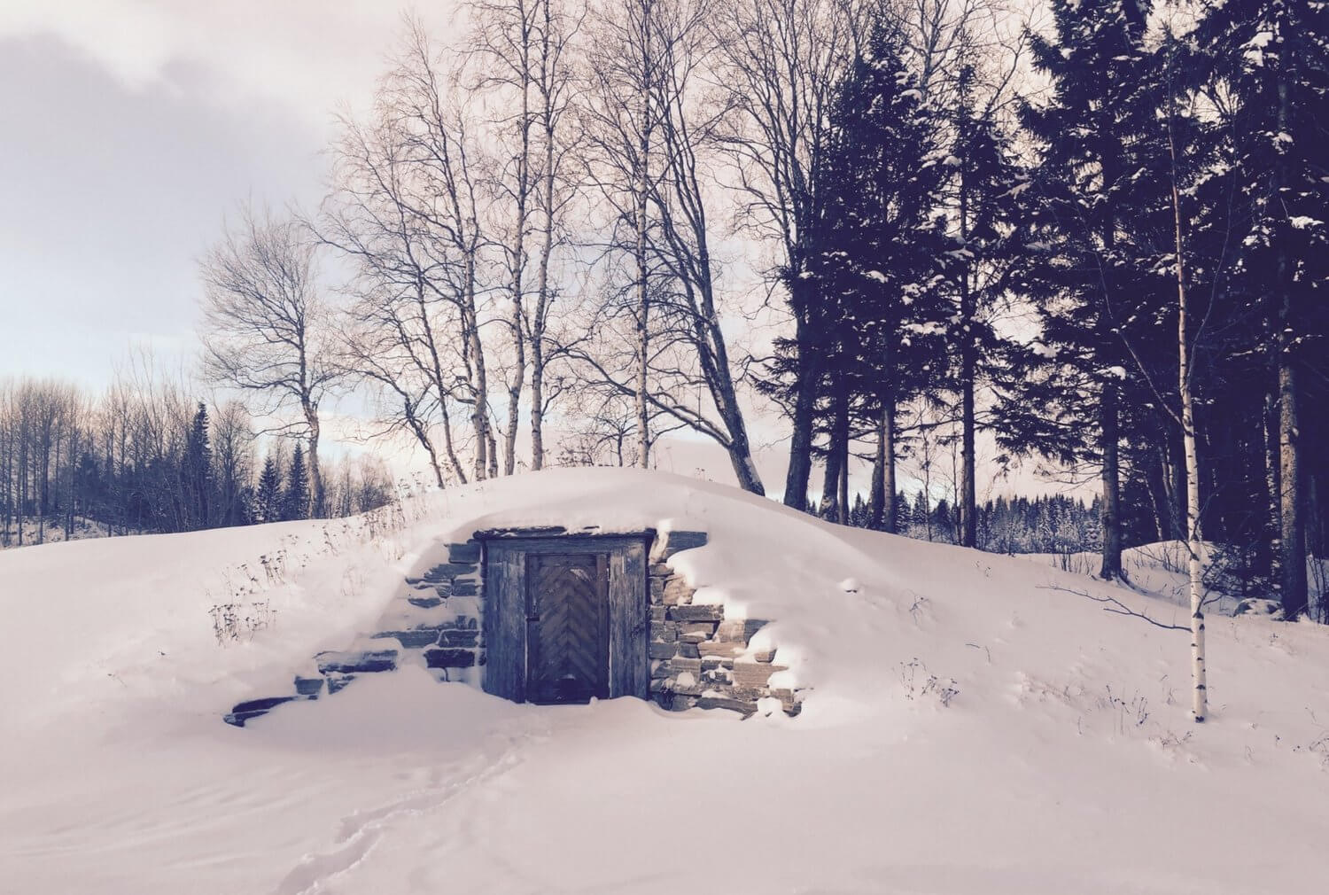 Fäviken’s own restaurant food cellar covered in snow in Northern Sweden