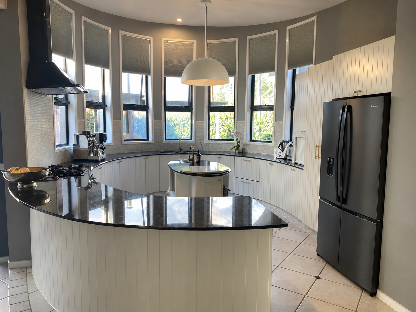 Curved Kitchen with Cream Dome Pendant.png