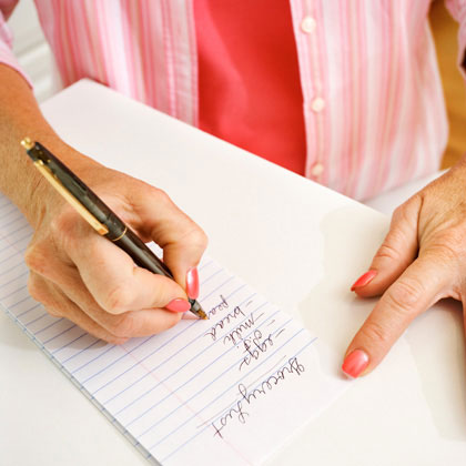 Woman writing grocery list (Source: babble.com )