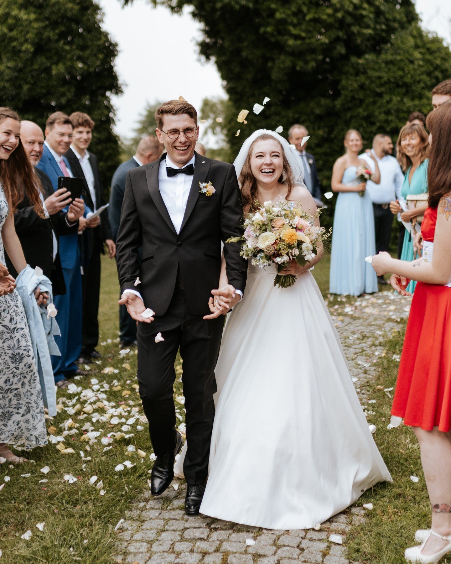 &quot;Our happily ever after took place far away in Germany. Though my wedding was far from home, I wanted to feel connected to Kentucky, so I chose a remote venue surrounded by orchards and fields. We got married in a small village church with a bil