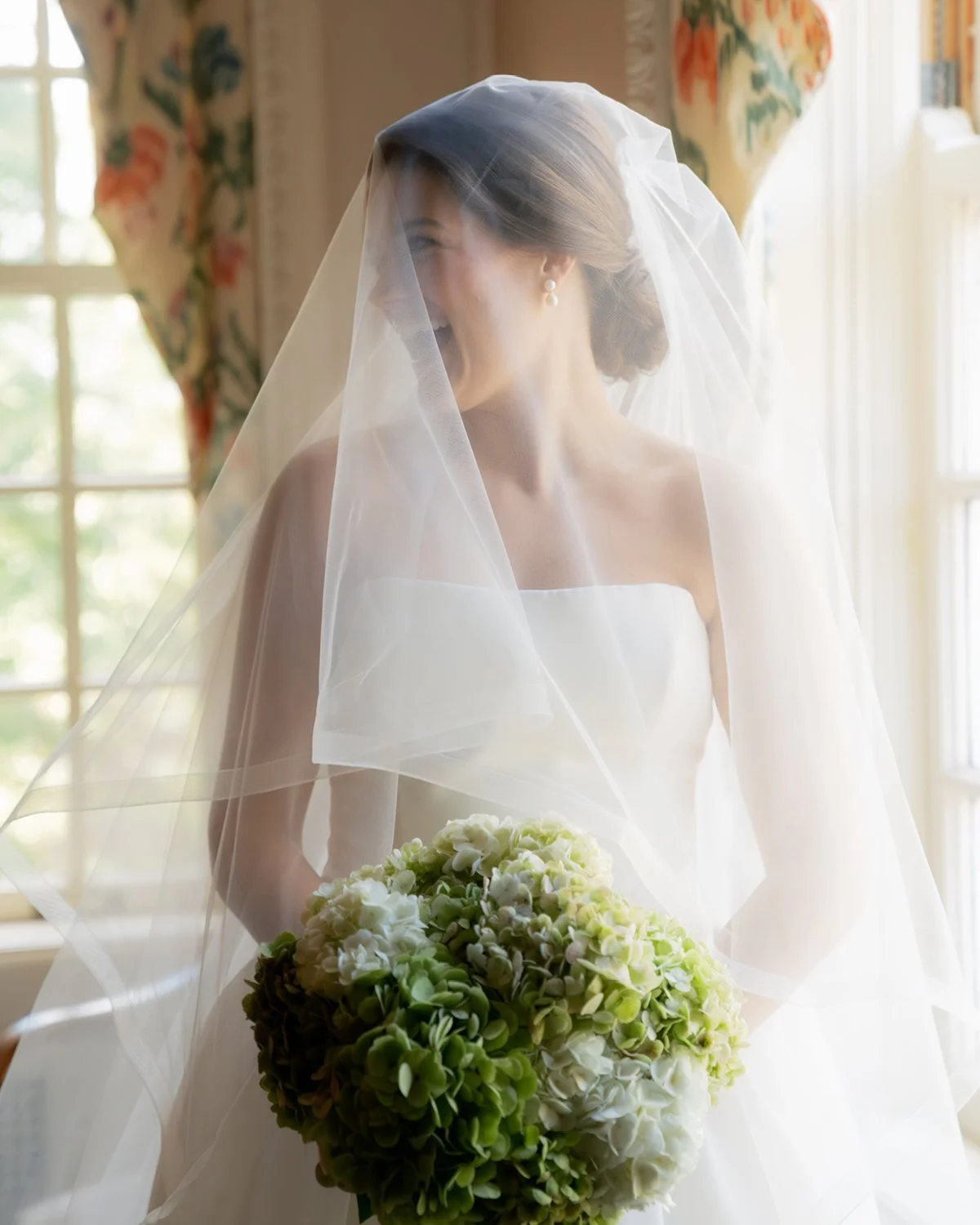 Mallory and Noah's wedding at Spindletop Hall in Lexington was everything they dreamed it would be. Shades of blue, lush hydrangeas, a sailcloth tent, and a candlelit dinner inside the historic estate created an elegant setting, while family heirloom