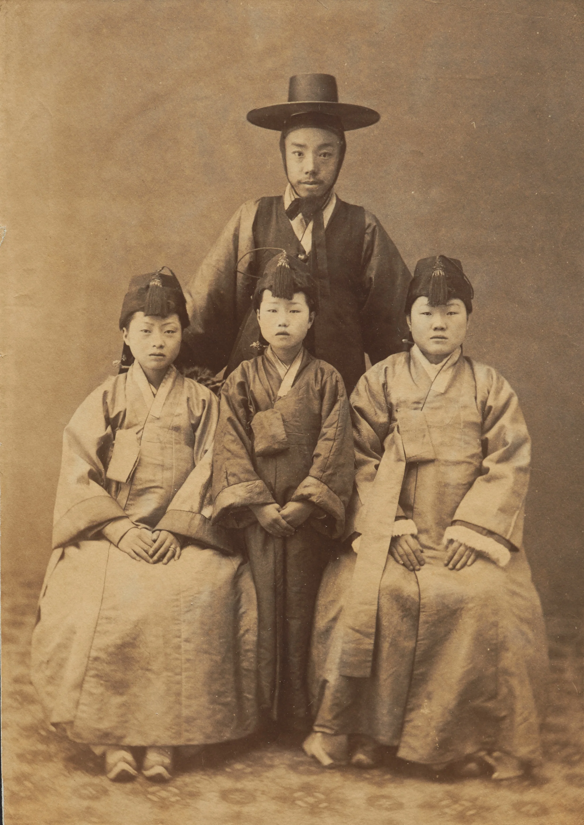 Korean Man and Three Girls, late 19th century, albumen print, Peabody Essex Museum