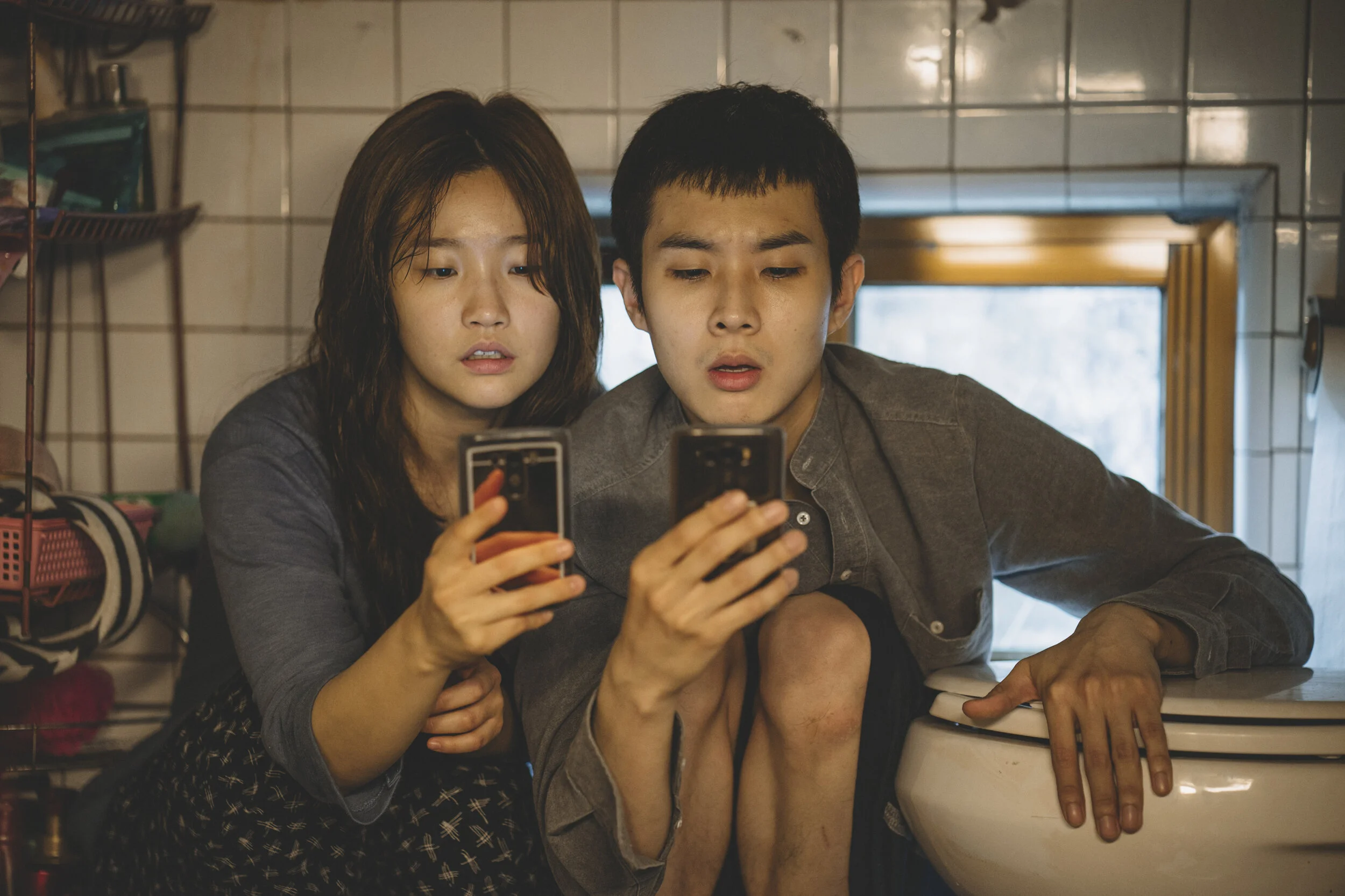 Ki-jung Kim (So-dam Park) and Ki-woo Park (Woo-sik Choi) in Parasite. Courtesy of NEON + CJ Entertainment.jpg