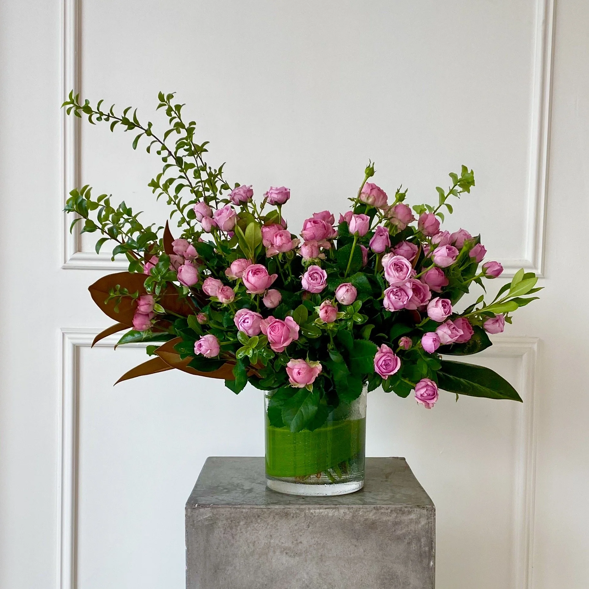 Vase arrangement of locally grown pink spray roses.