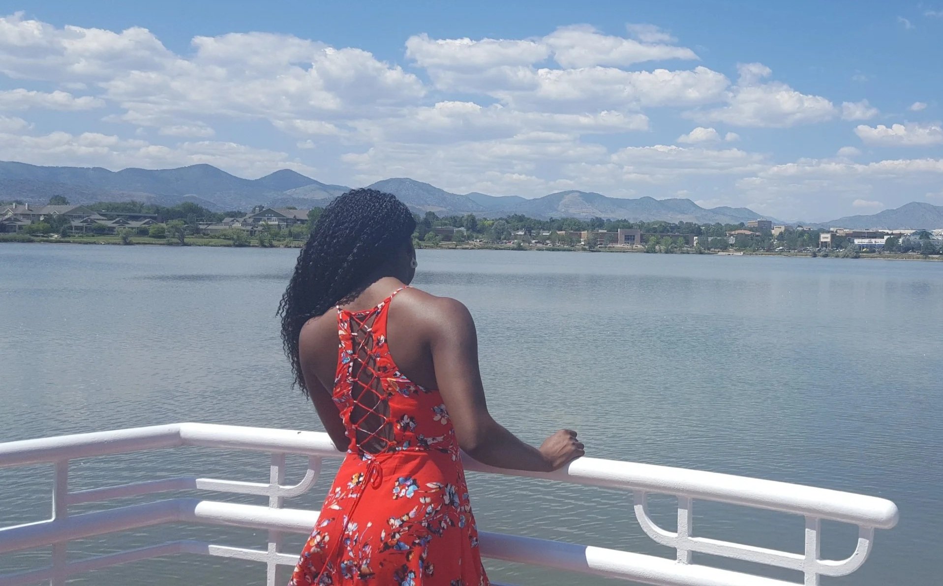 Woman looking out onto a lake