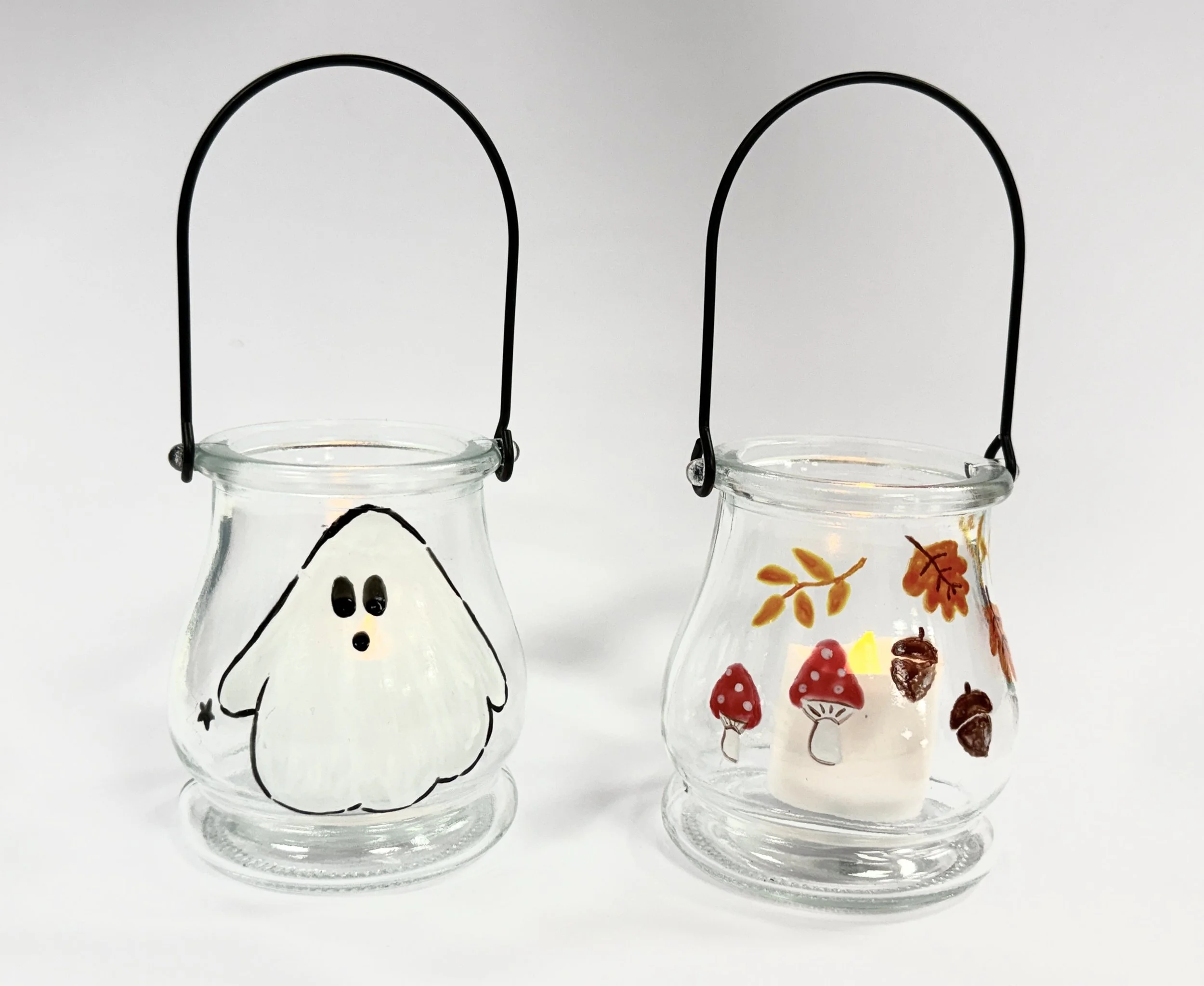 2 tea lights with ghost & leaves.jpg