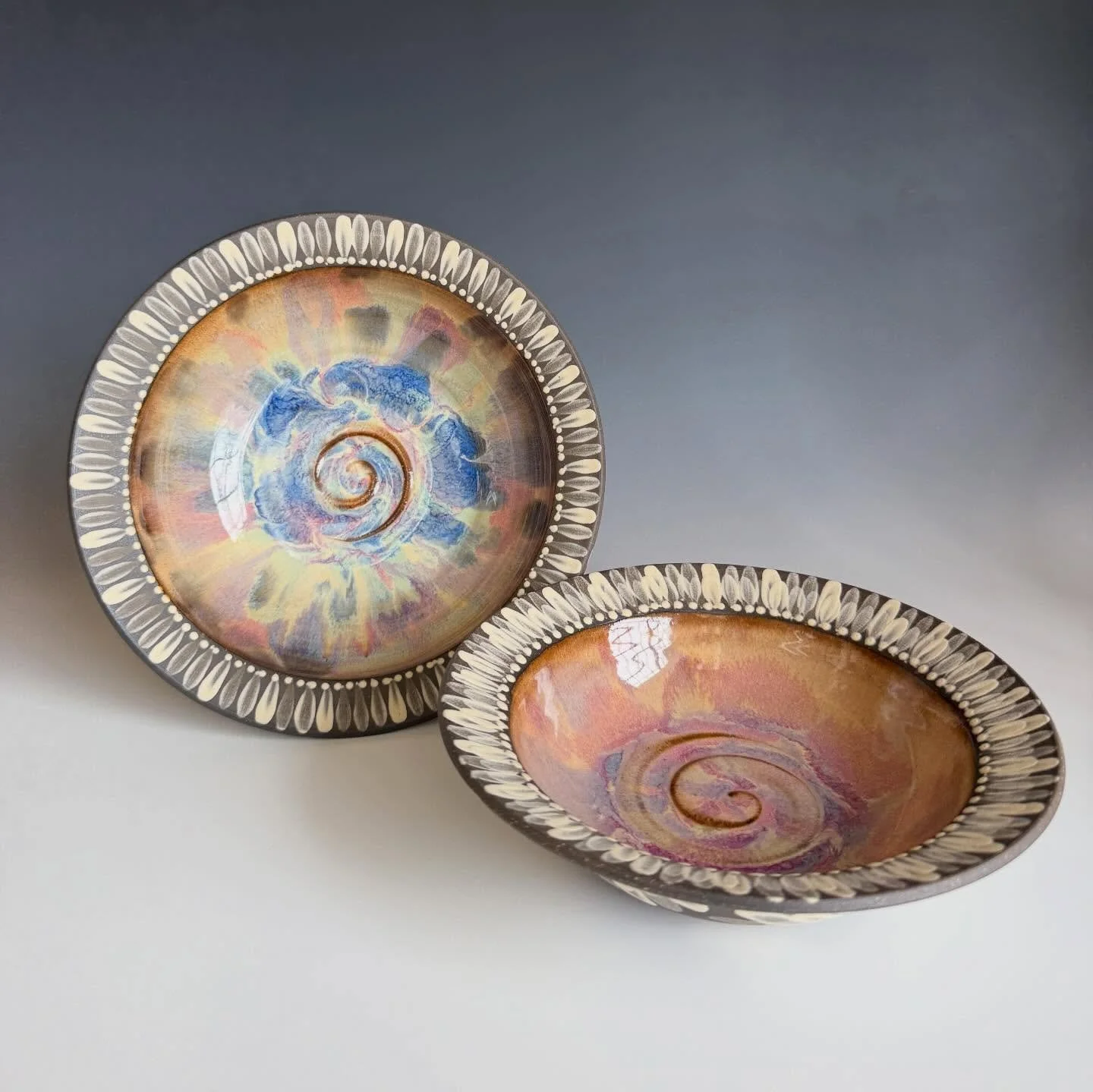 Some recent favorites from the kiln 🔥 

The first one I traded with a friend recently and it&rsquo;s got a lovey new home ☺️ the second one is still up for adoption! 🧡💜🩷