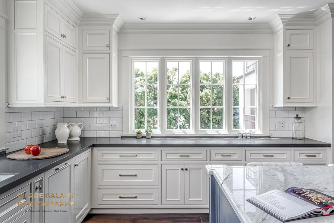 The open kitchen and dining area are the focal points of the main floor.