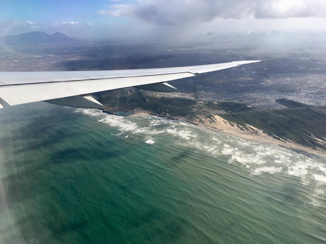 Flying in to the Cape Town airport. Remember that summer in the Northern Hemisphere is 'winter' here, so bring clothes for chilly weather!