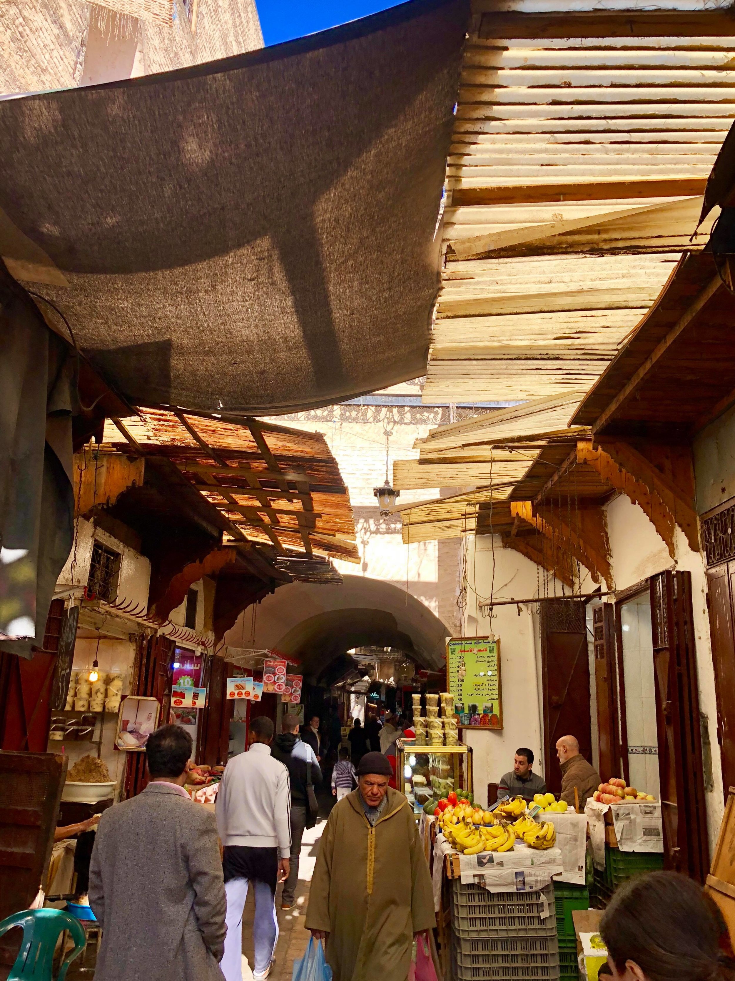  We walk by a store-front that sells large amounts of preserved beef (?) in lard. Looks good. 