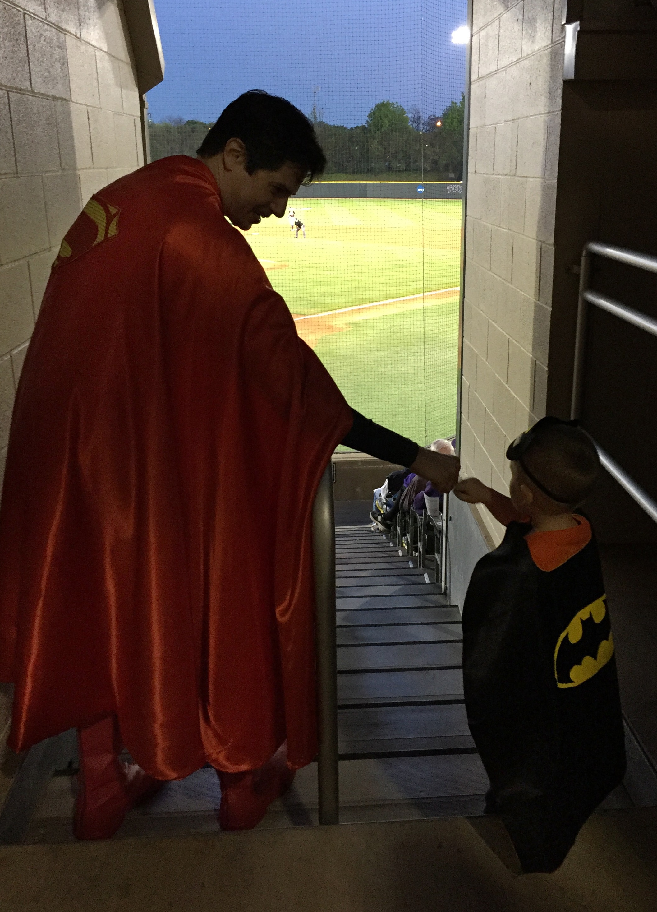 Superman shares a fist bump with the Caped Crusader.