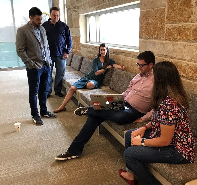 The projekt202 team reviews notes before their public presentation.