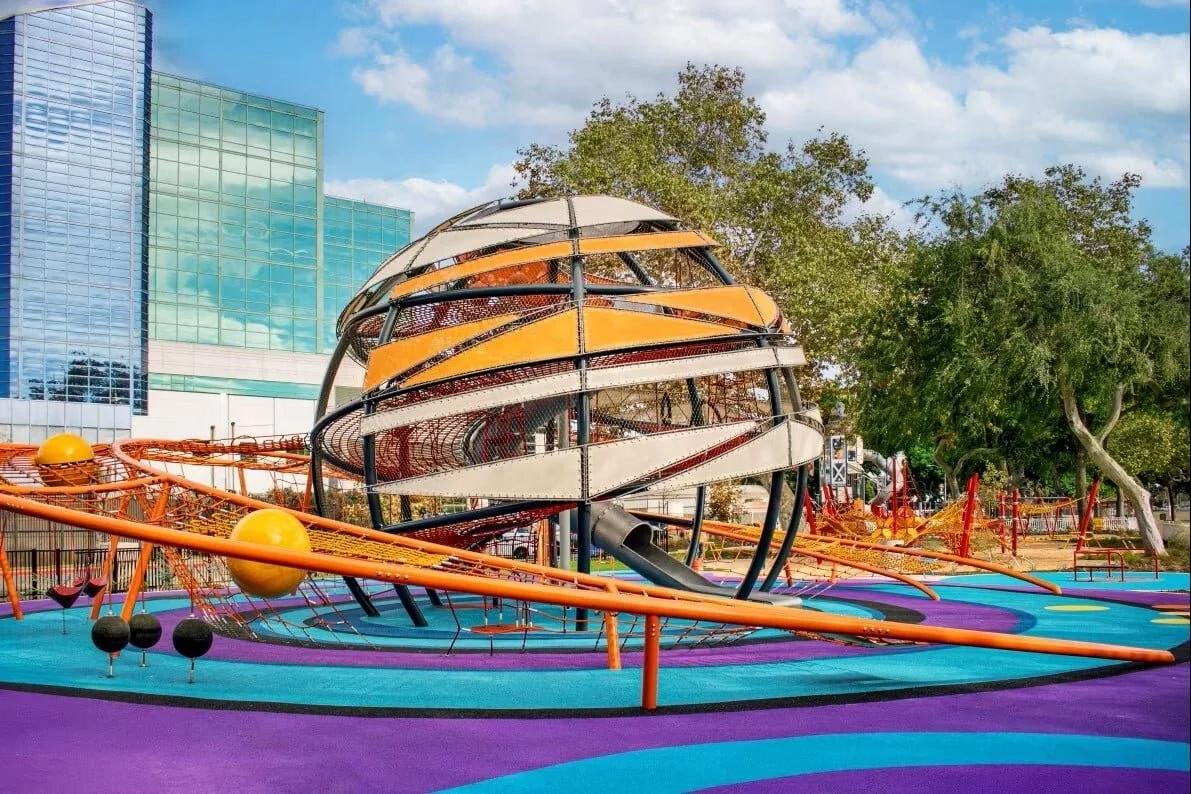 🪐🚀 Honoring the area's Space Age roots through a modern design approach, Lynwood Mega Playground stands out with eye-catching features like the 22-foot-wide &ldquo;Saturn Sphere&rdquo; and a towering rocket-themed structure that invites children to