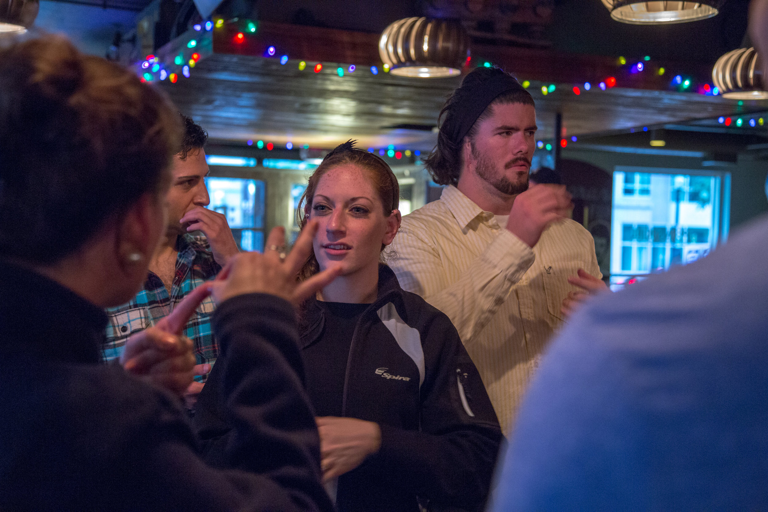 Katie Giles, 26, and Shelby Bean, 25, enjoy a conversation with friends in ASL at Penn Social, a bar in downtown, Washington, D.C. on May 14, 2016.