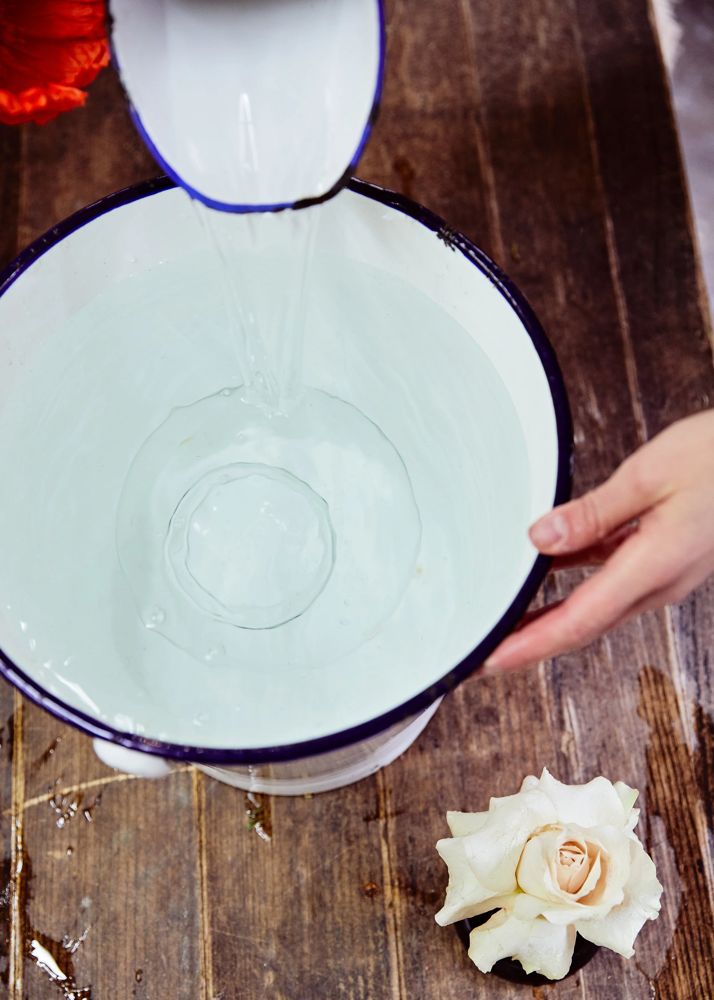 Submerge the glass globe in cold water