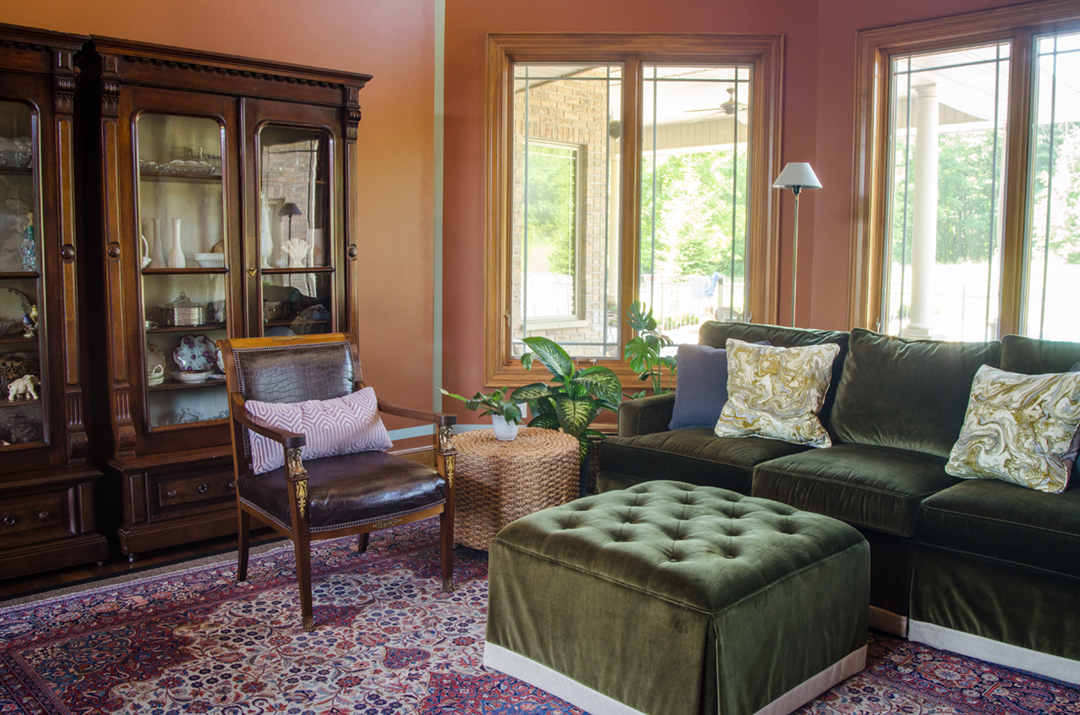 The green velvet sofa helped make this voluminous space feel cozy and comfortable.