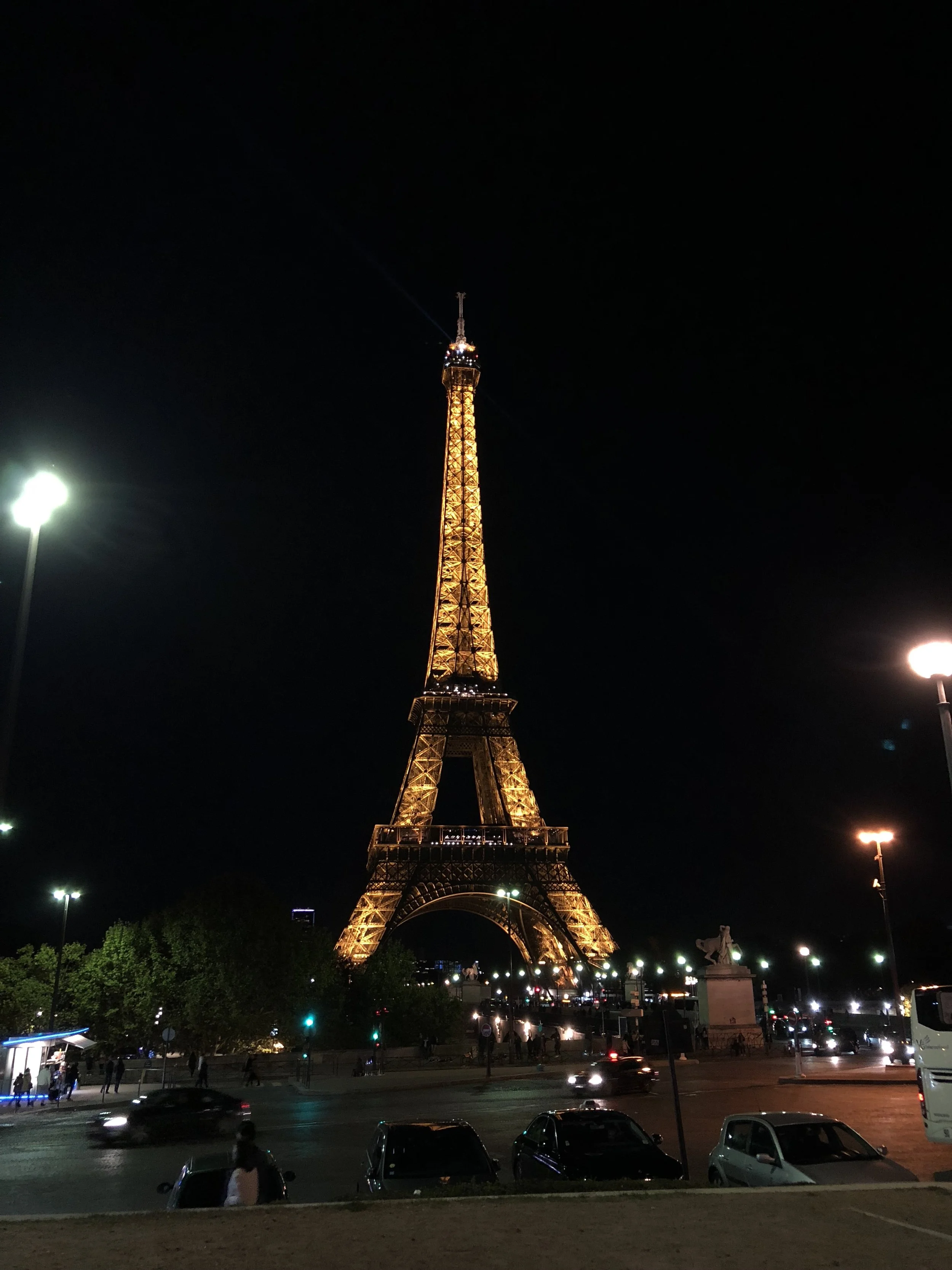 The Eiffel Tower at night. Lit up with lights
