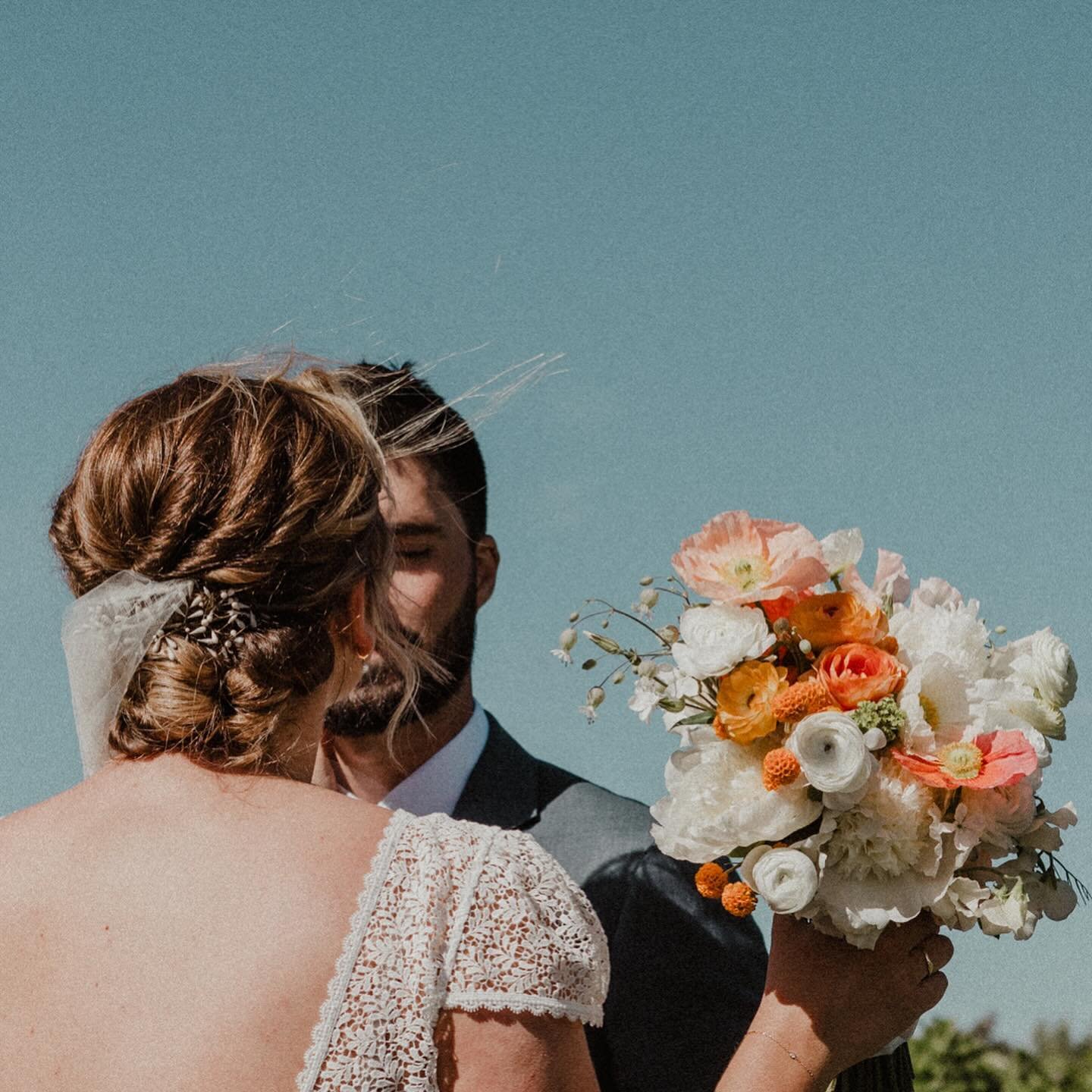 .
this incredible day at @theorchard.hr it was all: blue skies and orange flowers and the mountain was like a poem in the background; it was a ceremony with breezes that swooped veils into the air and a cake with tiny edible blossoms and a blue wave 