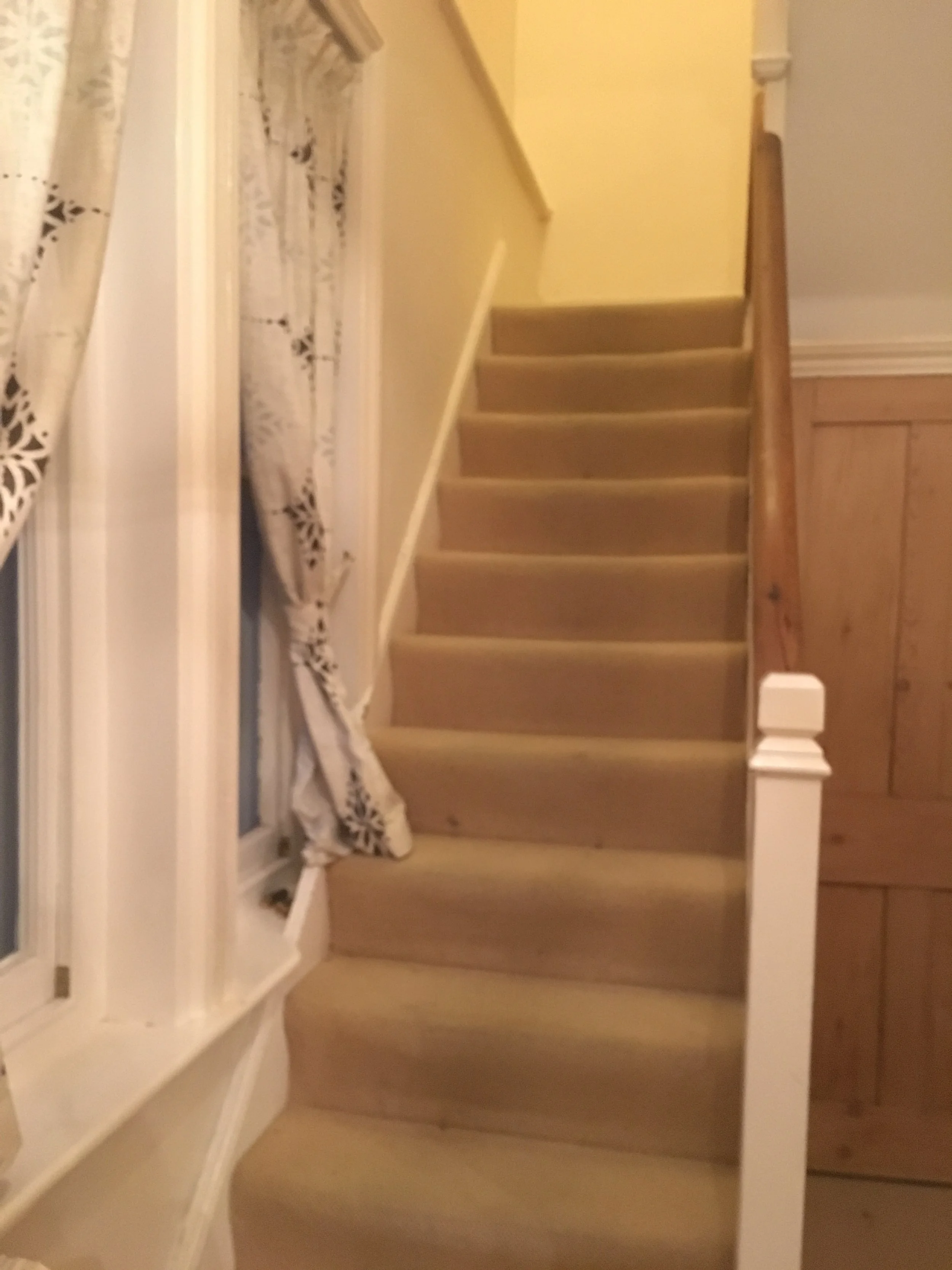 Taken with the real front door behind me, with the two arched windows over the staircase.