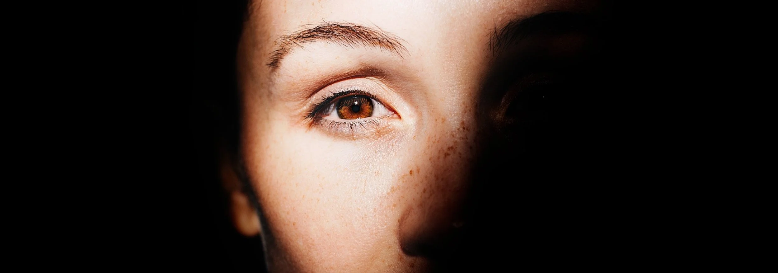 EMDR - women's eye visible through shadow